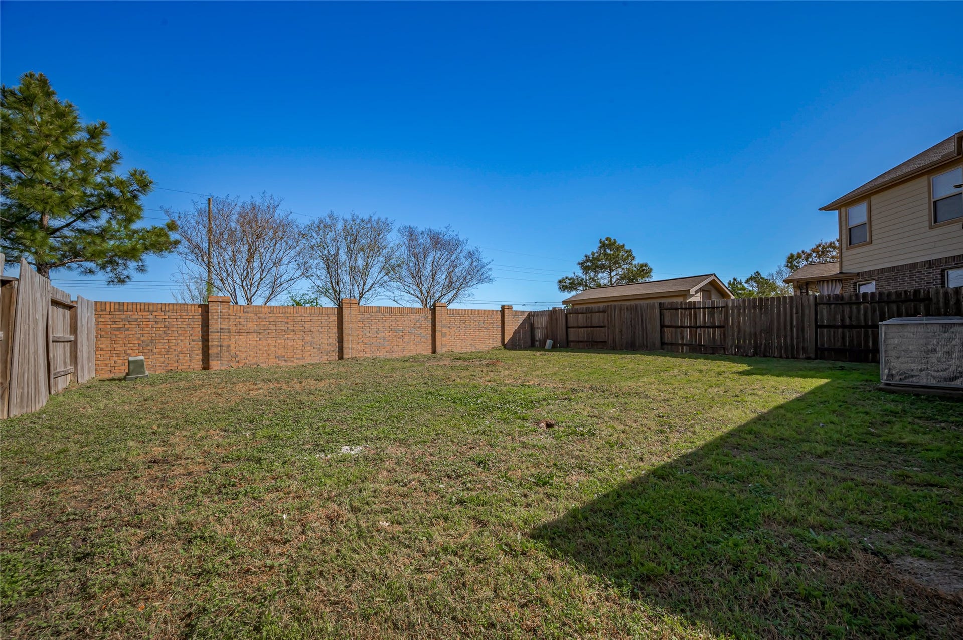 24114 Morrison Lane, Katy, TX 77493 Fenced backyard with a well maintained lawn.