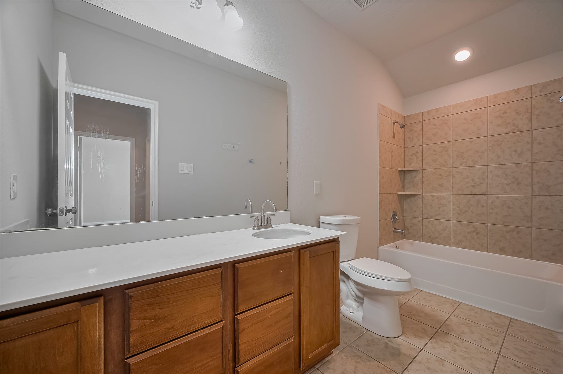 24114 Morrison Lane, Katy, TX 77493 Bathroom features a spacious vanity with a large mirror & wooden cabinetry.