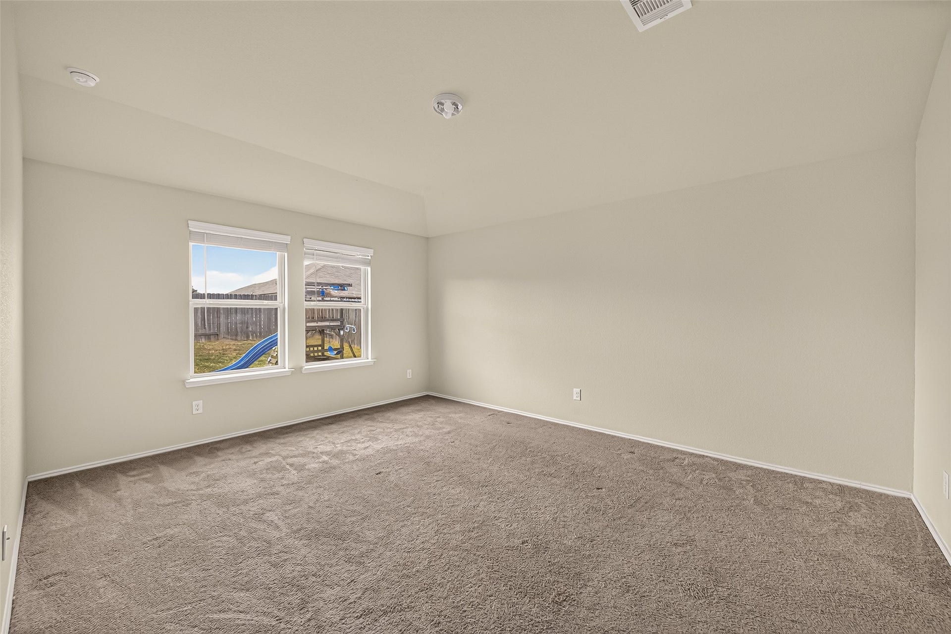 1714 Cooper Bluff Court, Rosenberg, TX 77469 Master bedroom is huge and has big windows with carpet throughout.