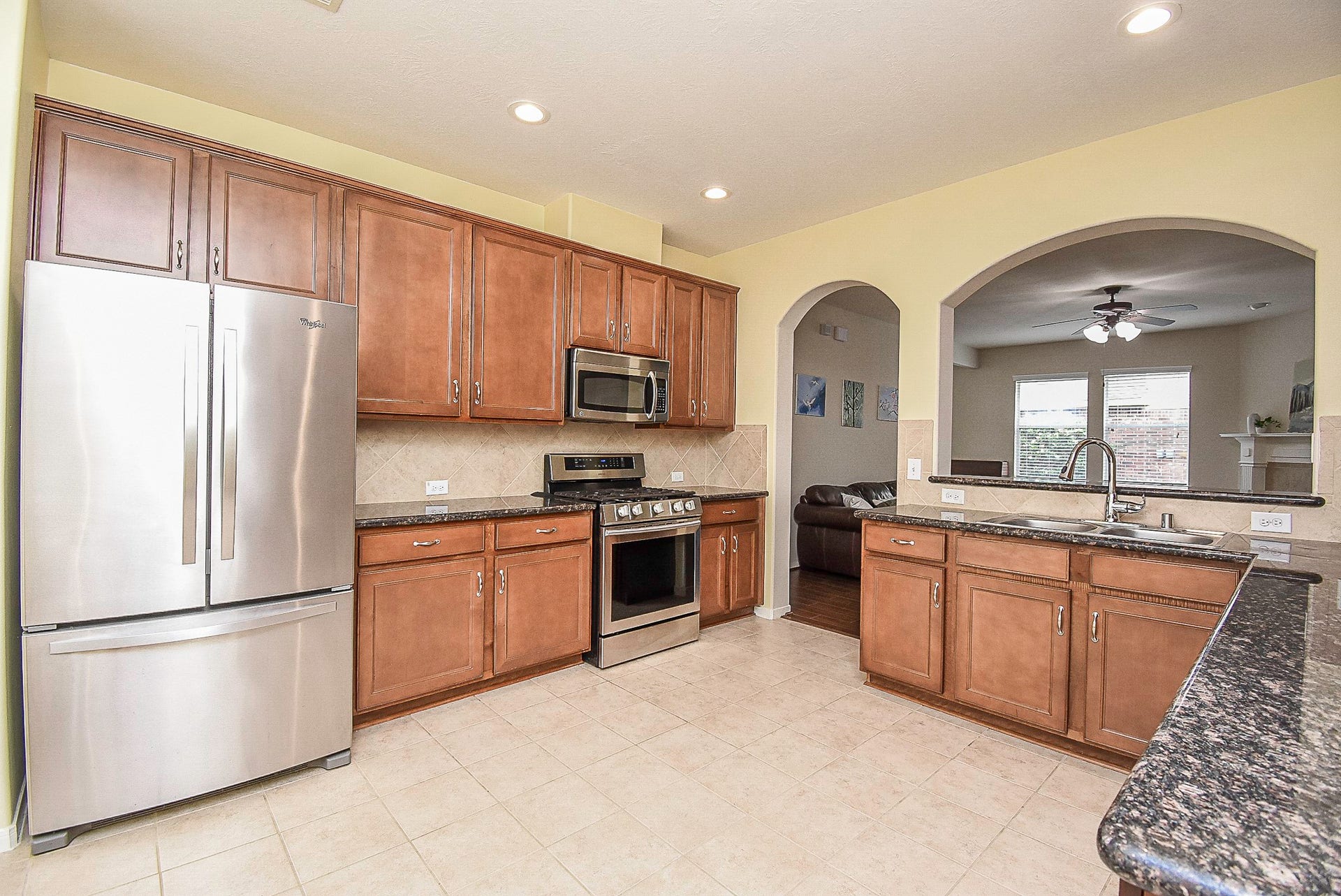 3615 Morning Gale Lane, Katy, TX 77494 Modern recessed lighting illuminates the open kitchen.