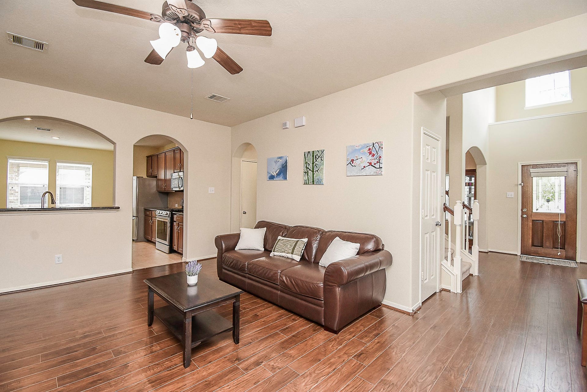 3615 Morning Gale Lane, Katy, TX 77494 Another view showcasing the open layout and seamless flow between the living room, kitchen, and entryway.