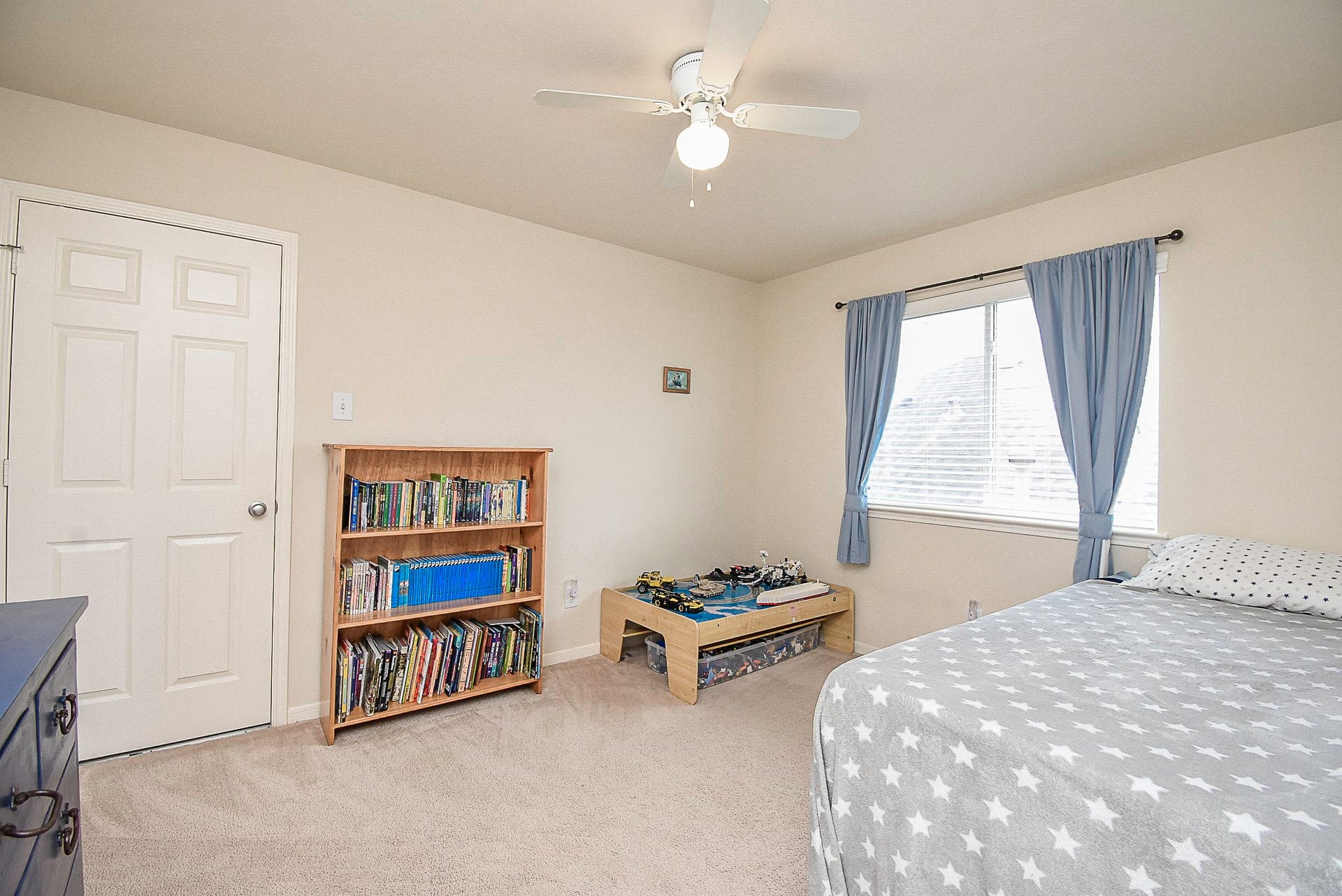 3615 Morning Gale Lane, Katy, TX 77494 Spacious secondary bedroom featuring a ceiling fan and plenty of closet space.