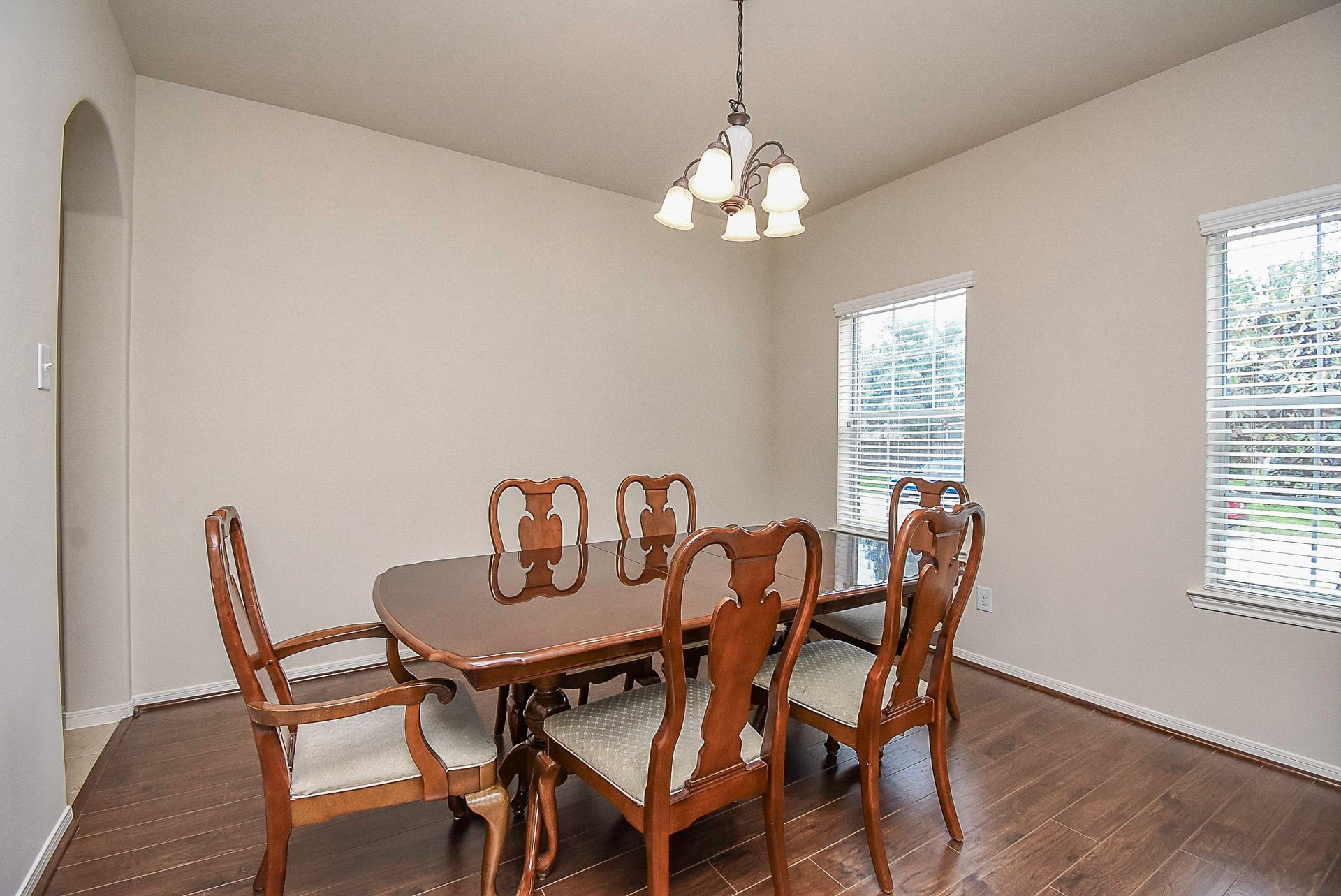 3615 Morning Gale Lane, Katy, TX 77494 Natural light fills the room, while a traditional chandelier completes the space.