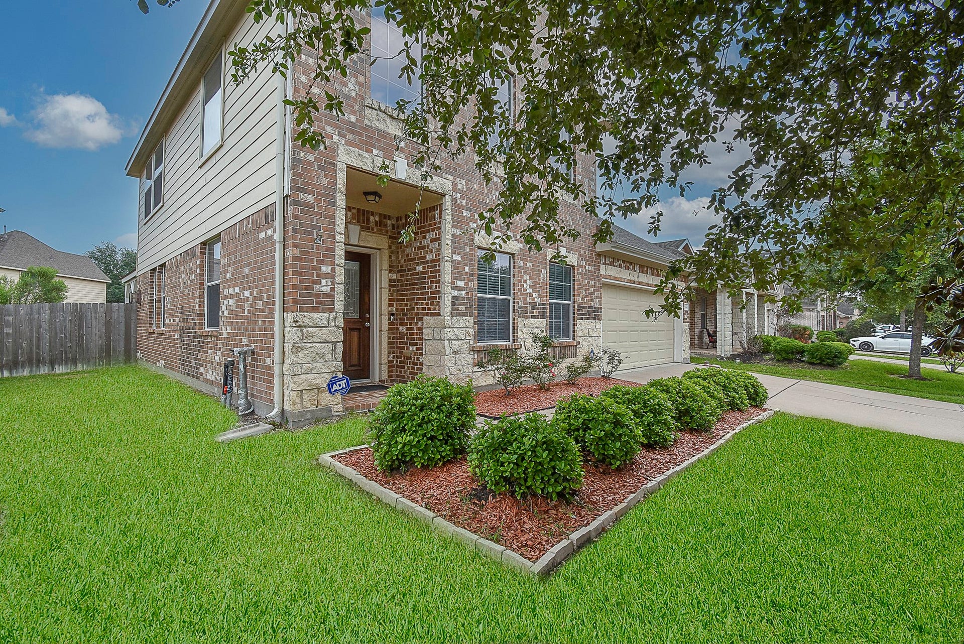 3615 Morning Gale Lane, Katy, TX 77494 Stone, brick and vinyl siding come together to create captivating curb appeal.