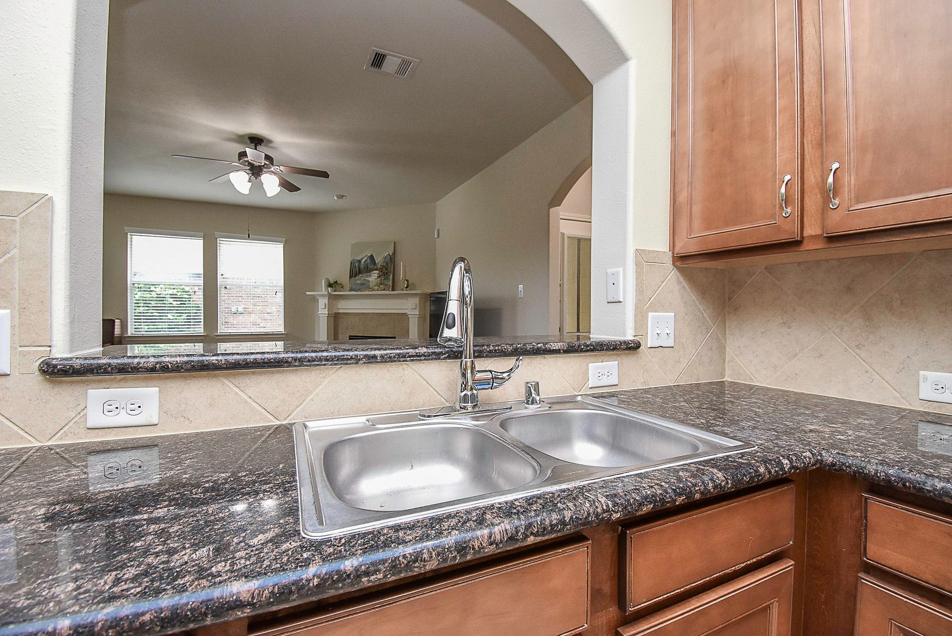 3615 Morning Gale Lane, Katy, TX 77494 Upgraded pull-down faucet head at the kitchen sink.