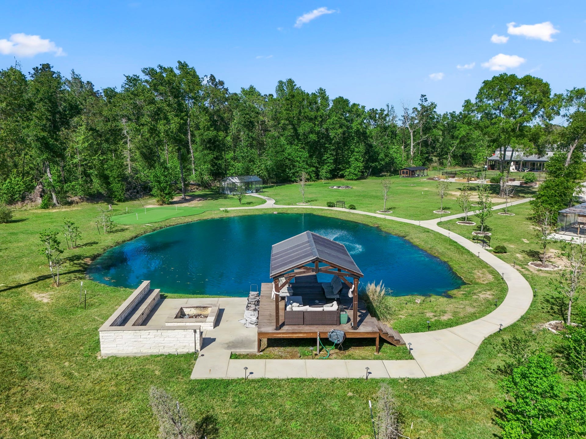 Pond with seating area and dock