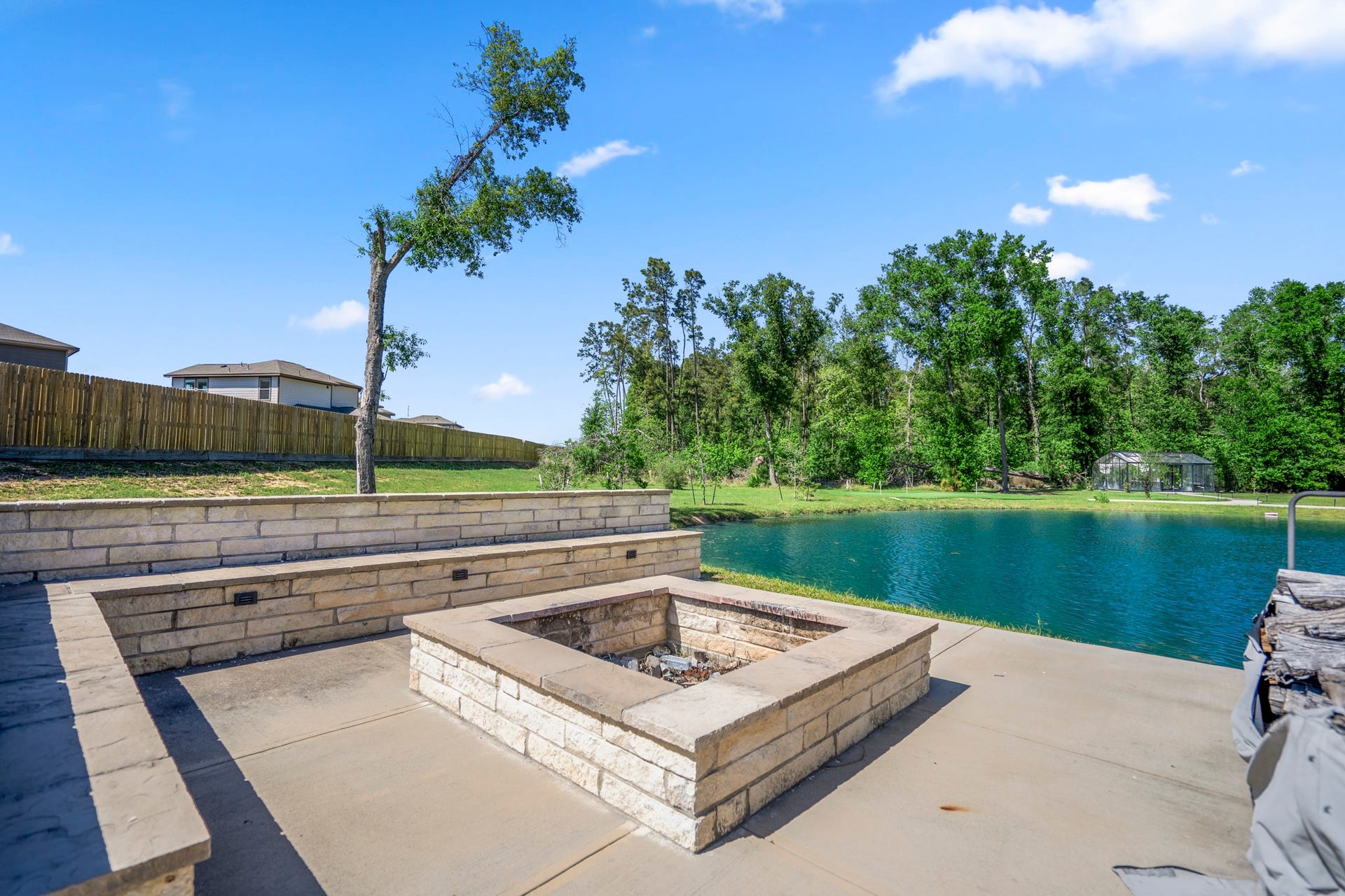 Pond with seating area and dock