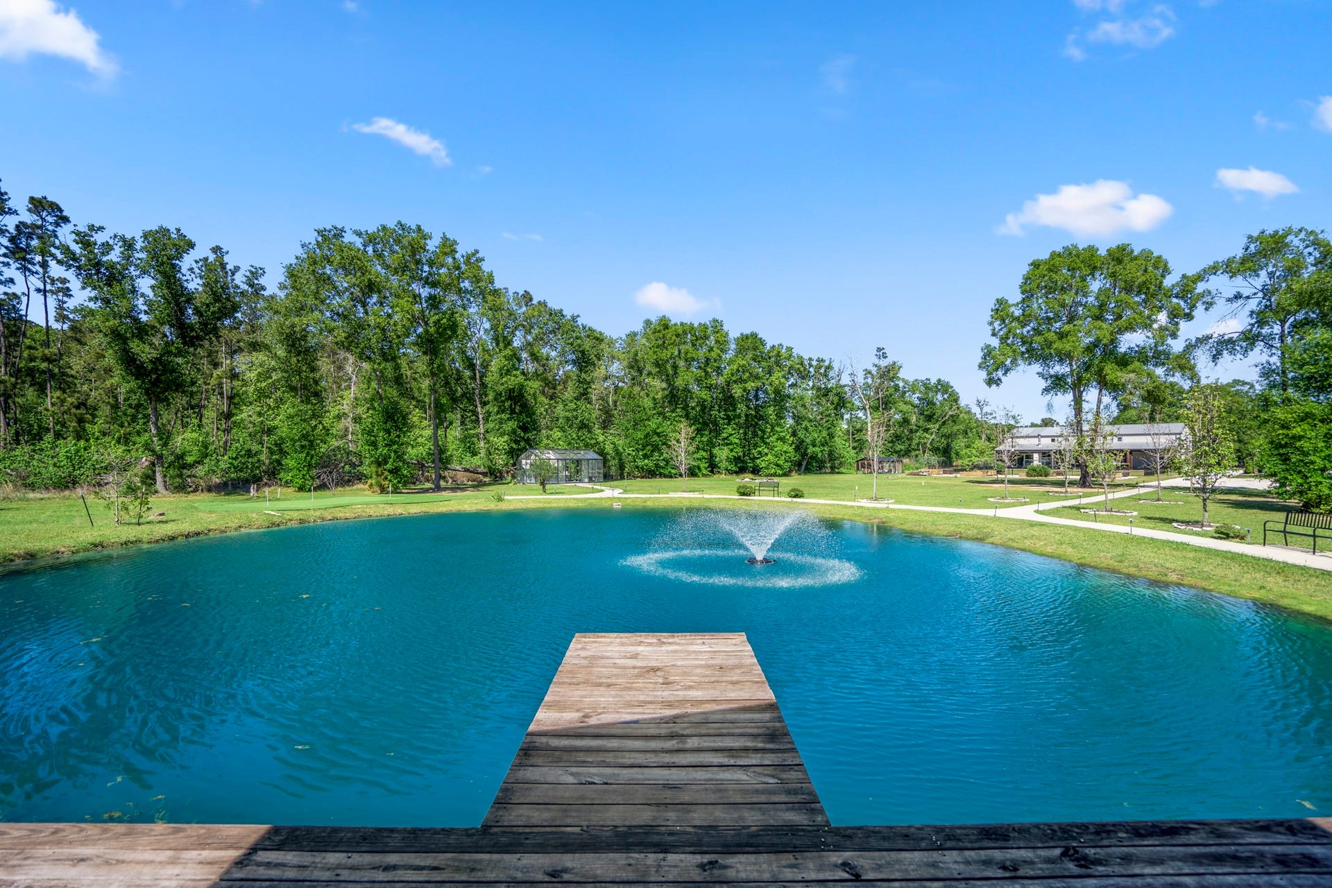 Pond with seating area and dock