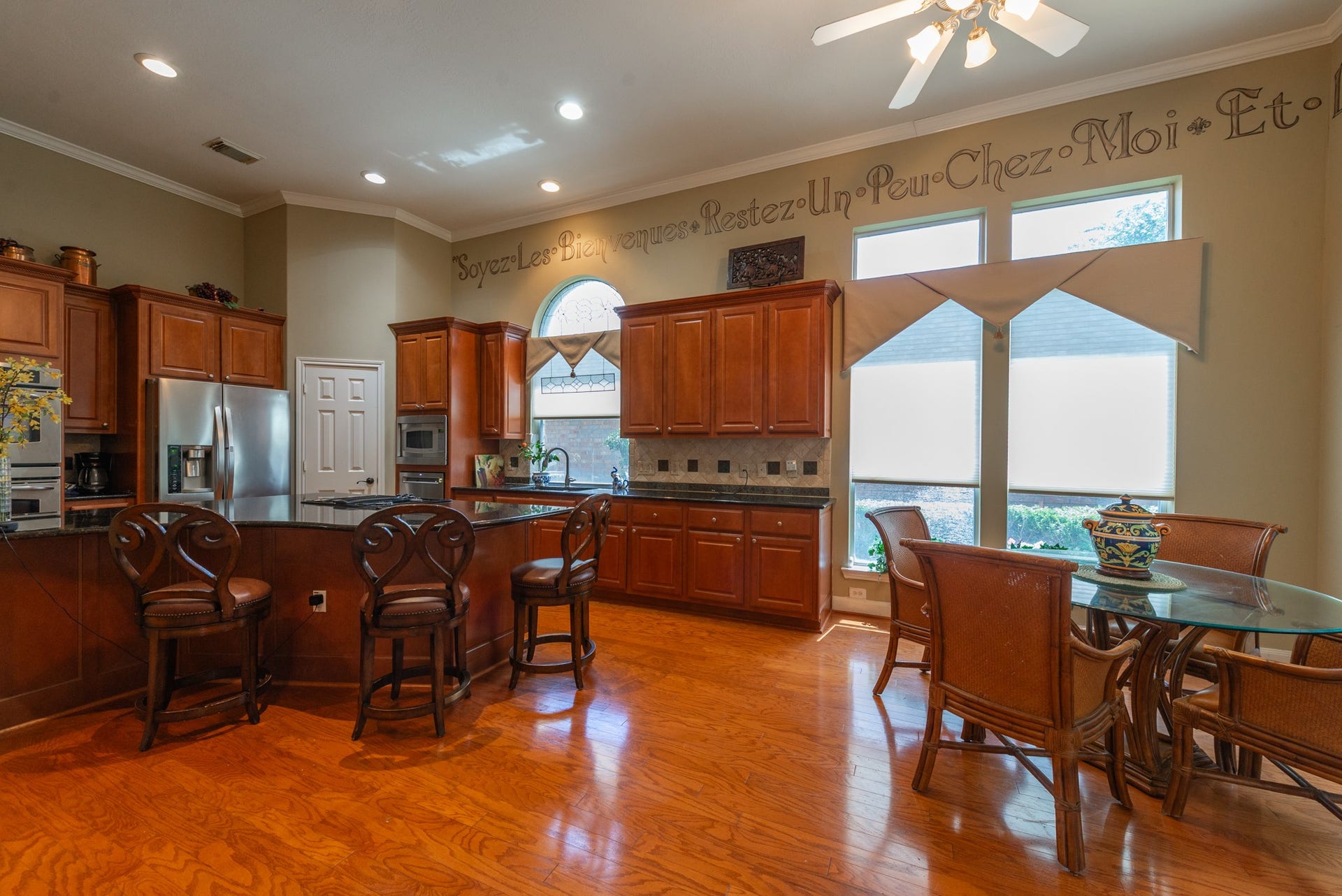 24922 Cinco Manor Lane, Katy, TX 77494 Spacious kitchen and breakfast area with abundant cabinetry, large island and oversized windows bringing in natural light.