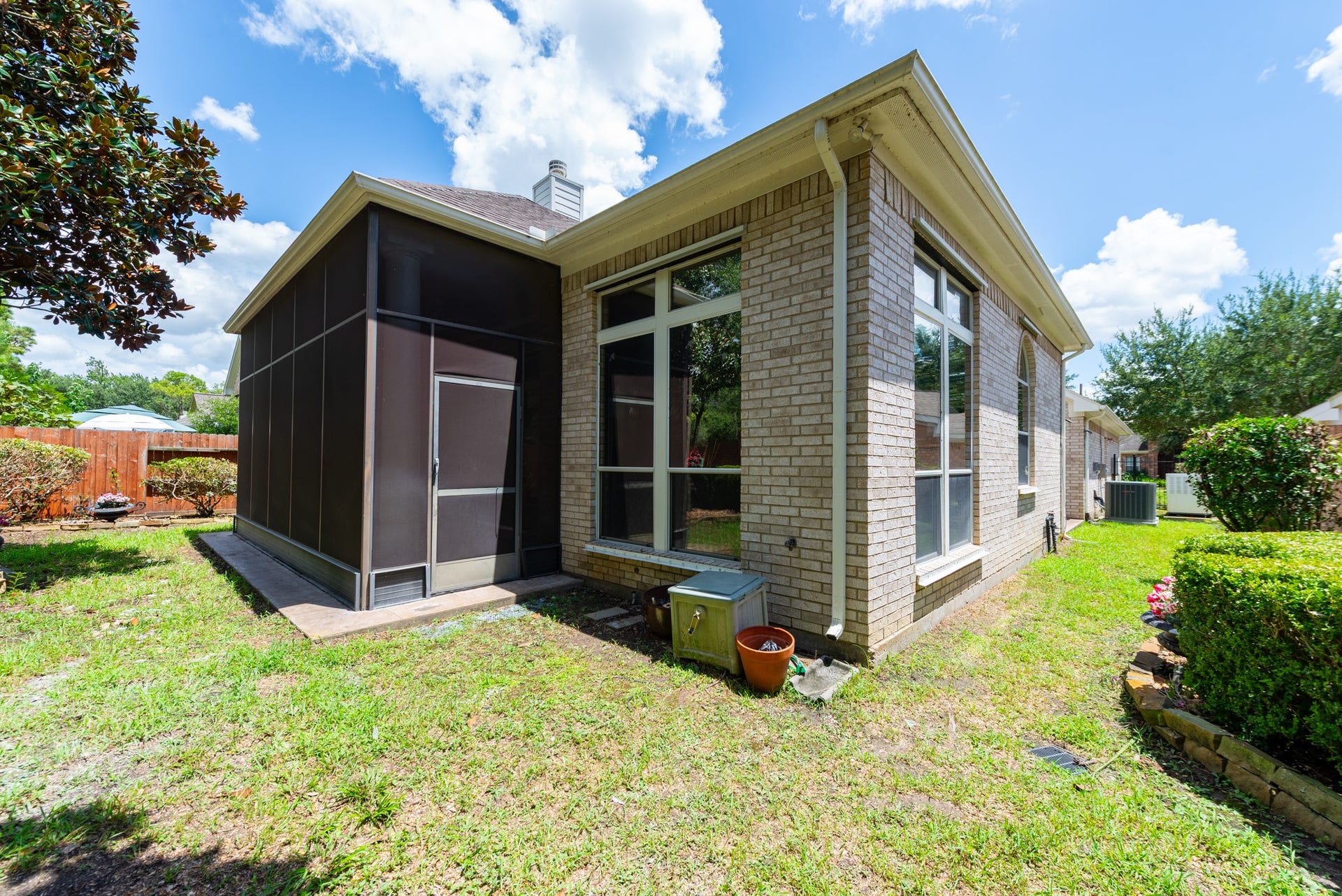24922 Cinco Manor Lane, Katy, TX 77494 Rear view highlighting the large screened patio and tall windows that bring natural light into the home.