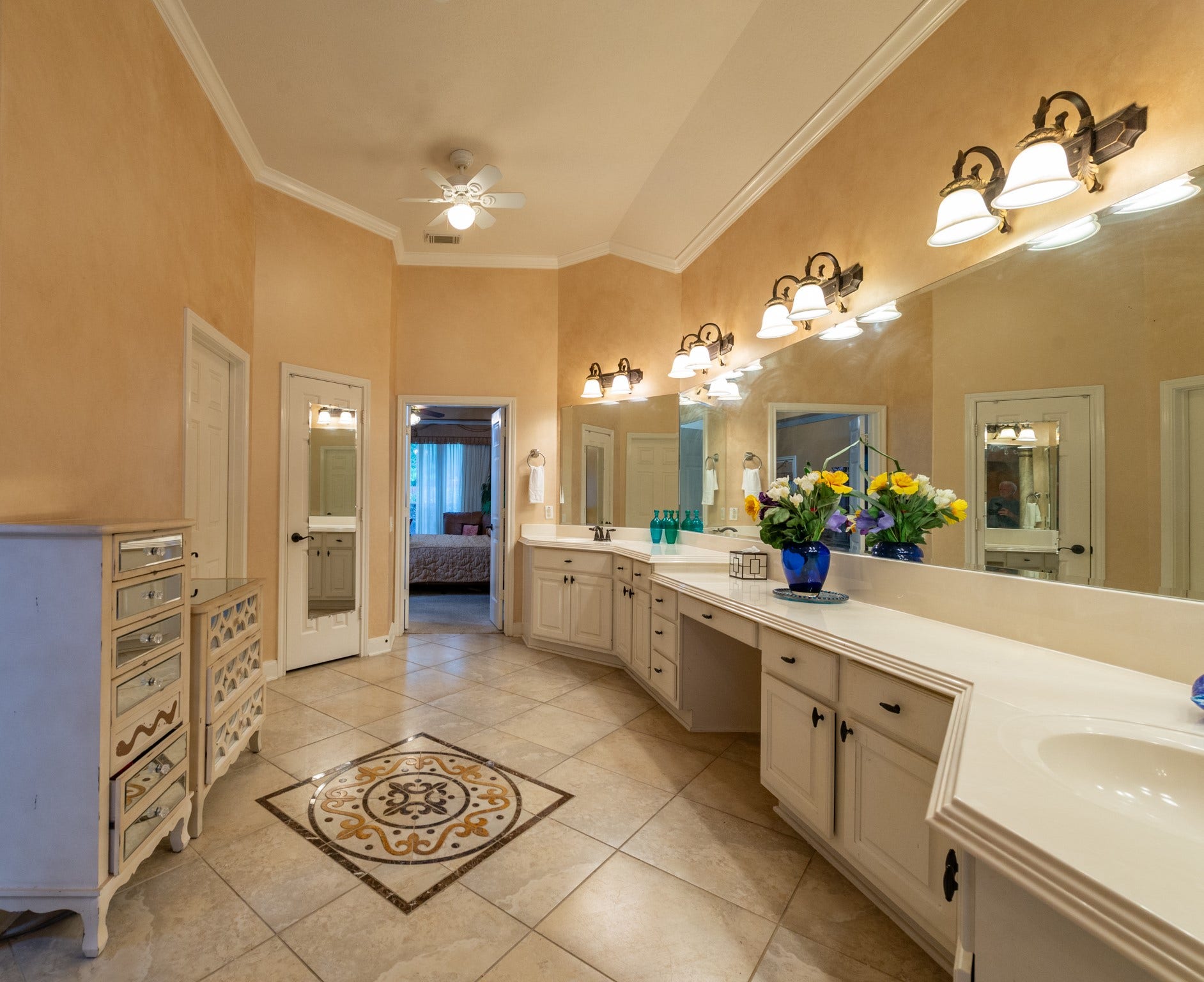 24922 Cinco Manor Lane, Katy, TX 77494 Another view showcases the exceptionally long vanity, abundant cabinetry, large mirror and decorative tile inlay.