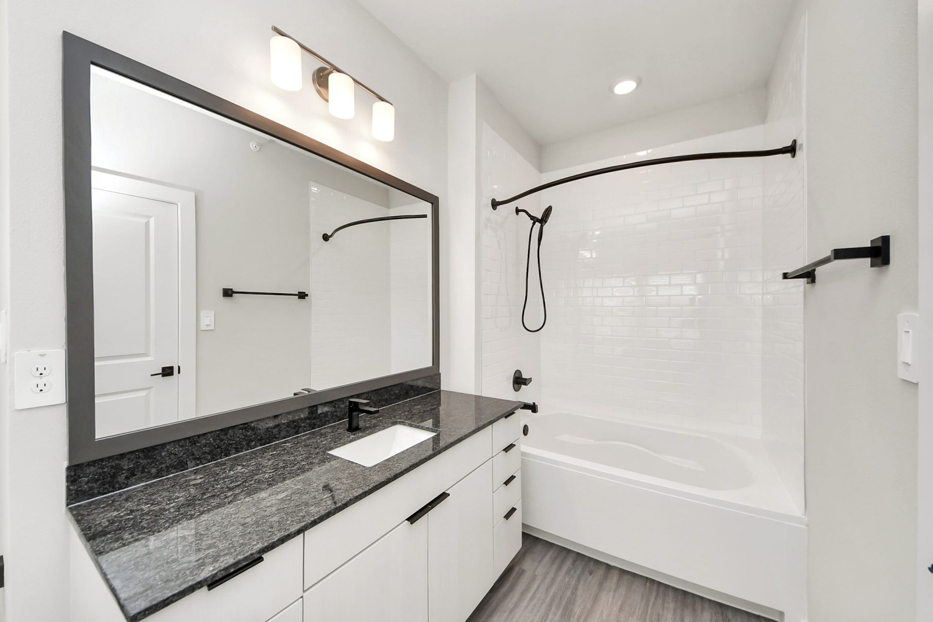 7711 Longmire Road, #97, Conroe, TX 77304 Primary Suite offers walk-closet,bath w/granite vanity&lux tub/shower.