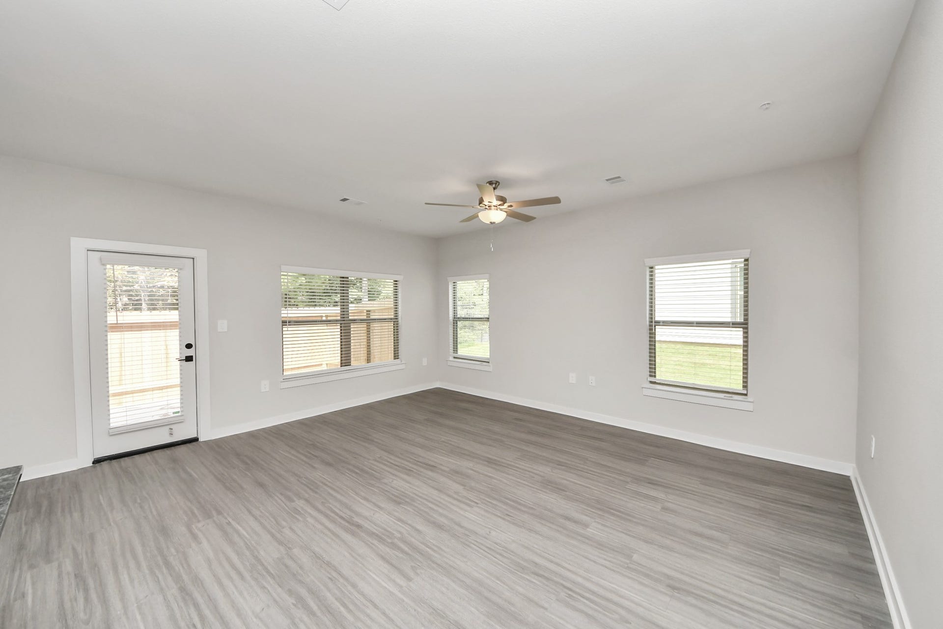 7711 Longmire Road, #97, Conroe, TX 77304 Boasting luxury finishes-stylish Island kitchen,granite counters,subway tile backsplash,ample custom cabinet space,stainless appliances,refrigerator,full size washer&dryer included,wood-like floors throughout,open concept floor plan.