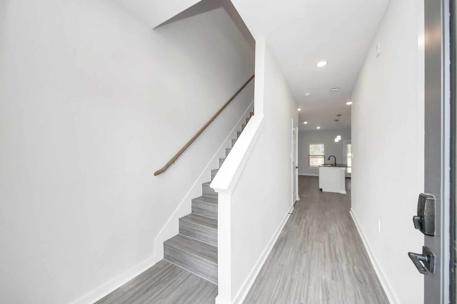7711 Longmire Road, #97, Conroe, TX 77304 Boasting luxury finishes-stylish Island kitchen,granite counters,subway tile backsplash,ample custom cabinet space,stainless appliances,refrigerator,full size washer&dryer included,wood-like floors throughout,open concept floor plan.