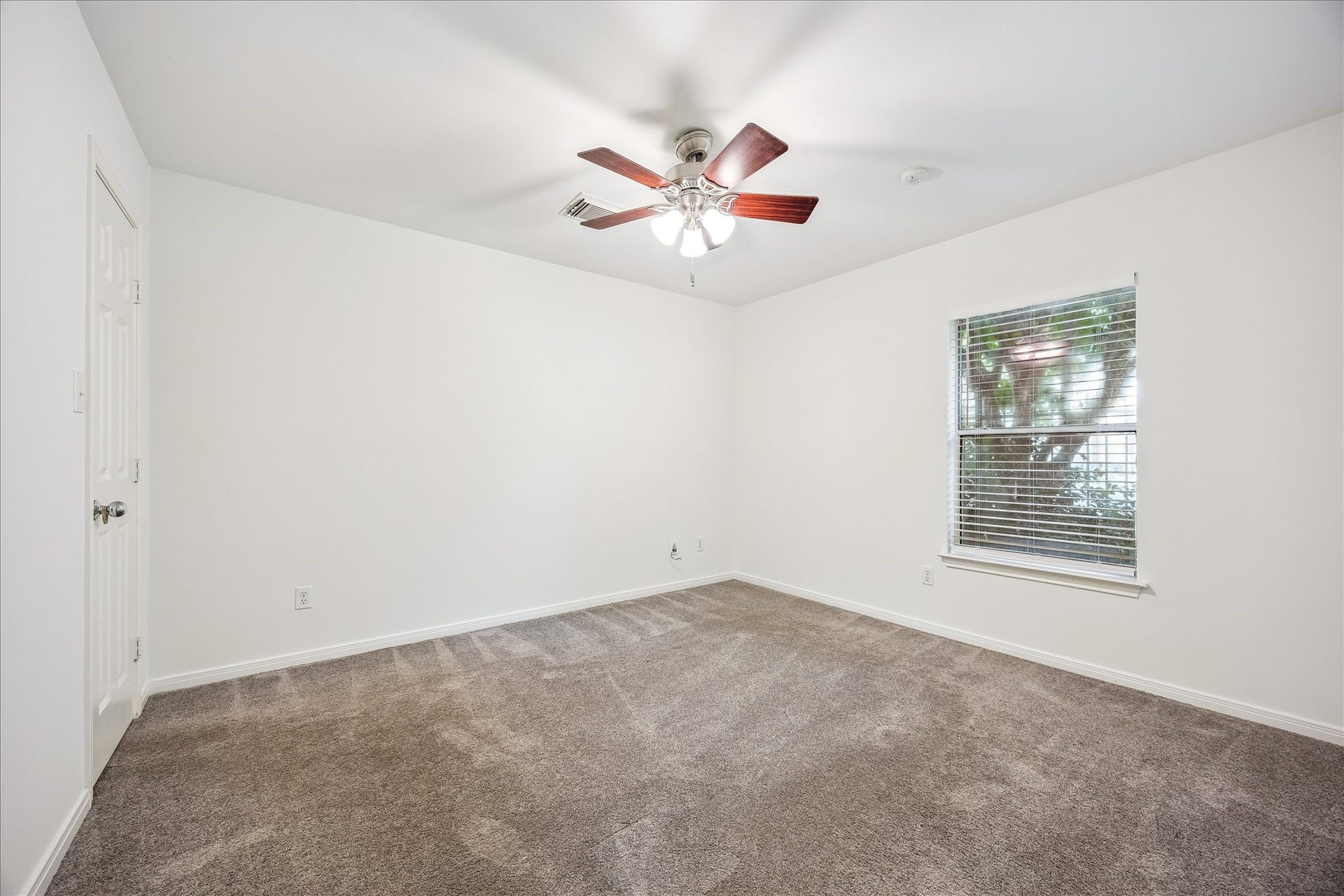 1008 Marconi Street, #A, Houston, TX 77019 Generously sized secondary bedroom conveniently located on the first floor for added privacy.