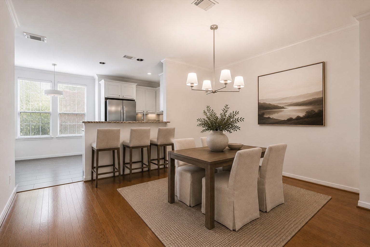 1008 Marconi Street, #A, Houston, TX 77019 Dedicated dining space with engineered hardwood floors and direct access to kitchen and breakfast bar. (Digitally staged image.)