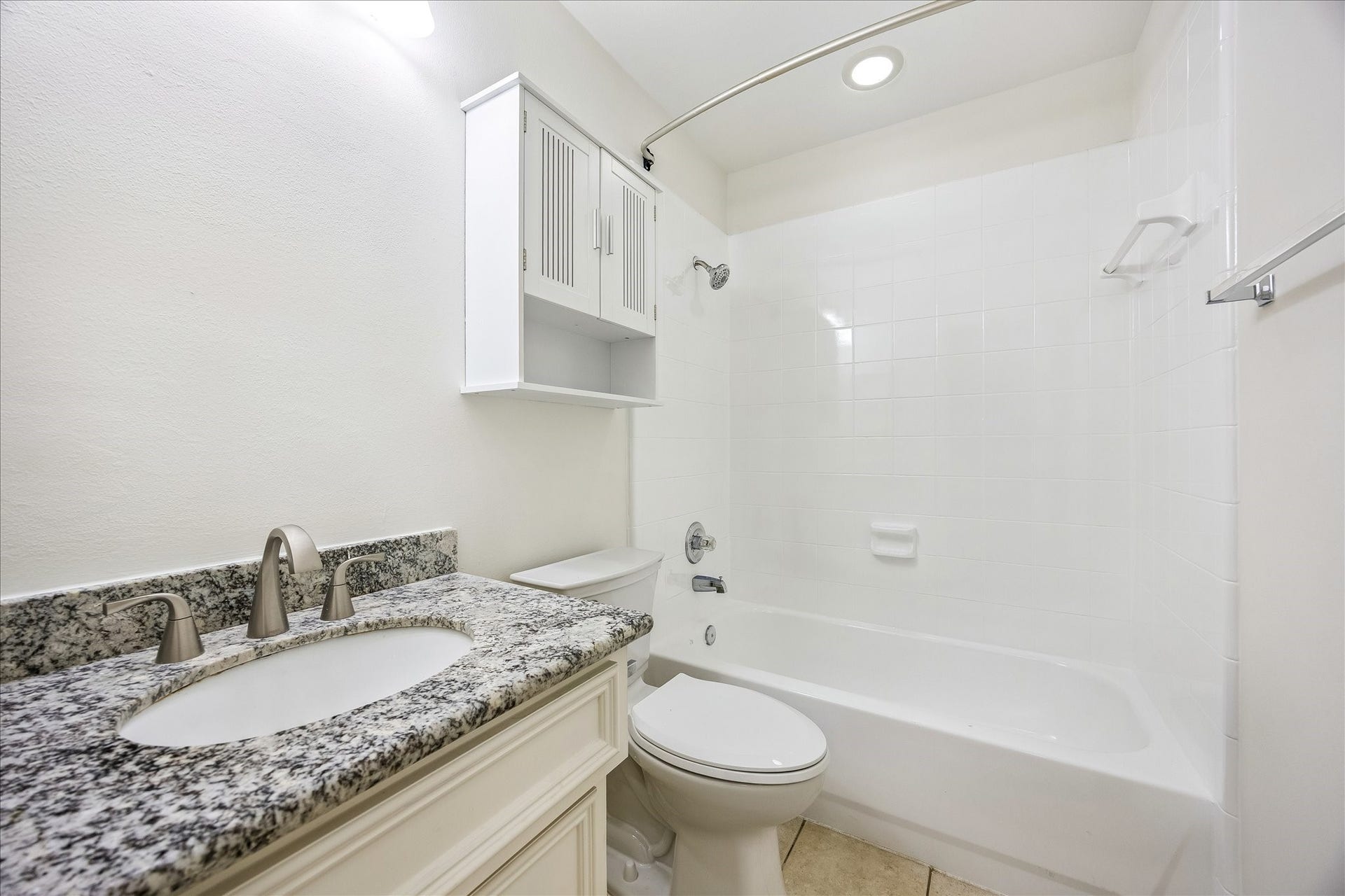 1008 Marconi Street, #A, Houston, TX 77019 Light and bright secondary bath with generous vanity and storage. (Mirror has since been installed.)