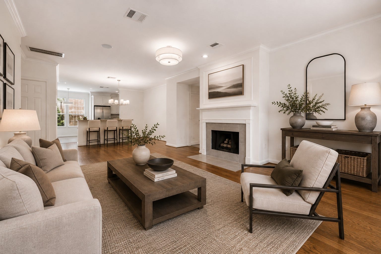 1008 Marconi Street, #A, Houston, TX 77019 Open-concept living with charming fireplace, engineered hardwood floors and abundance of natural light. (Digitally staged image.)