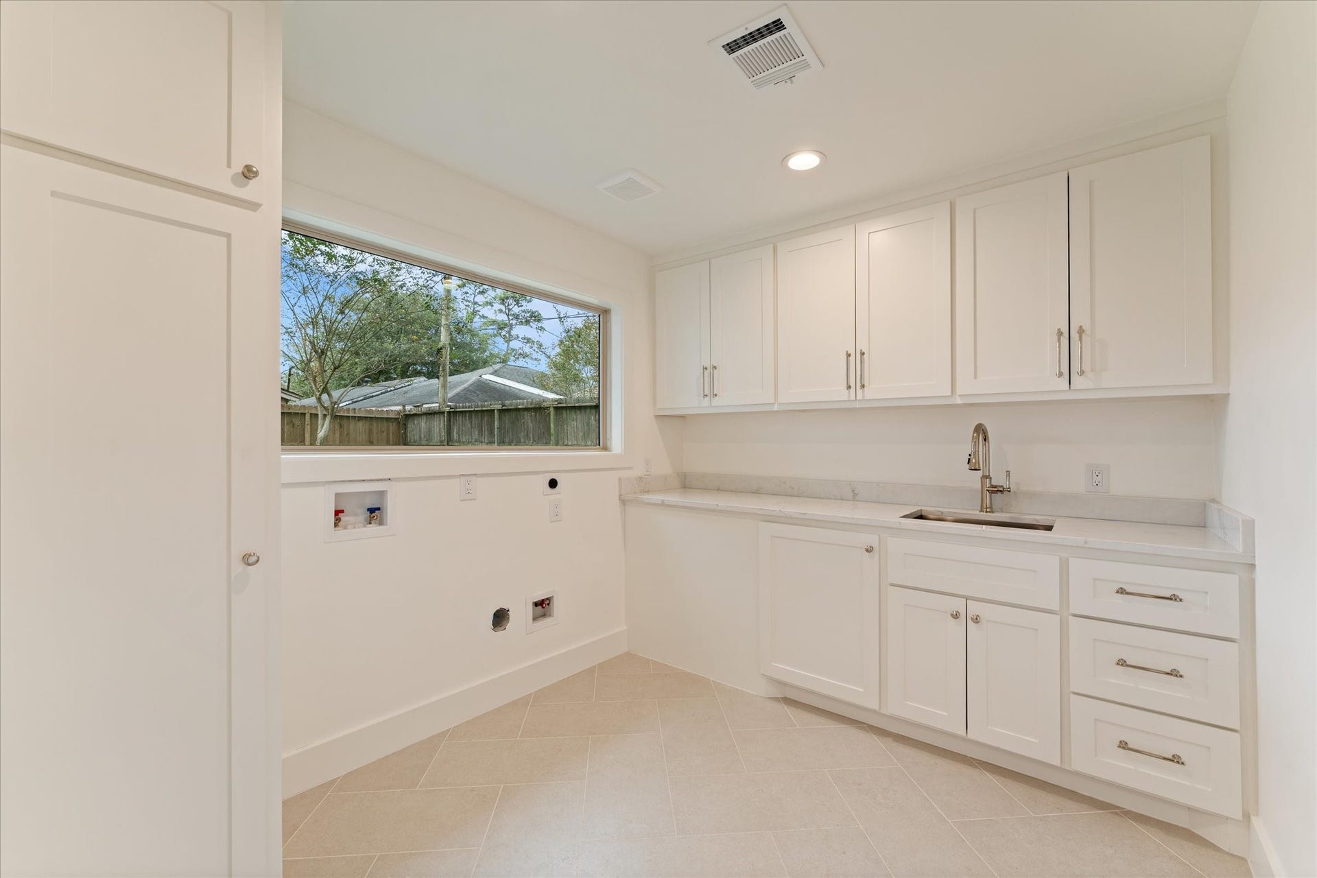 Laundry with sink!  Spacious and custom designed