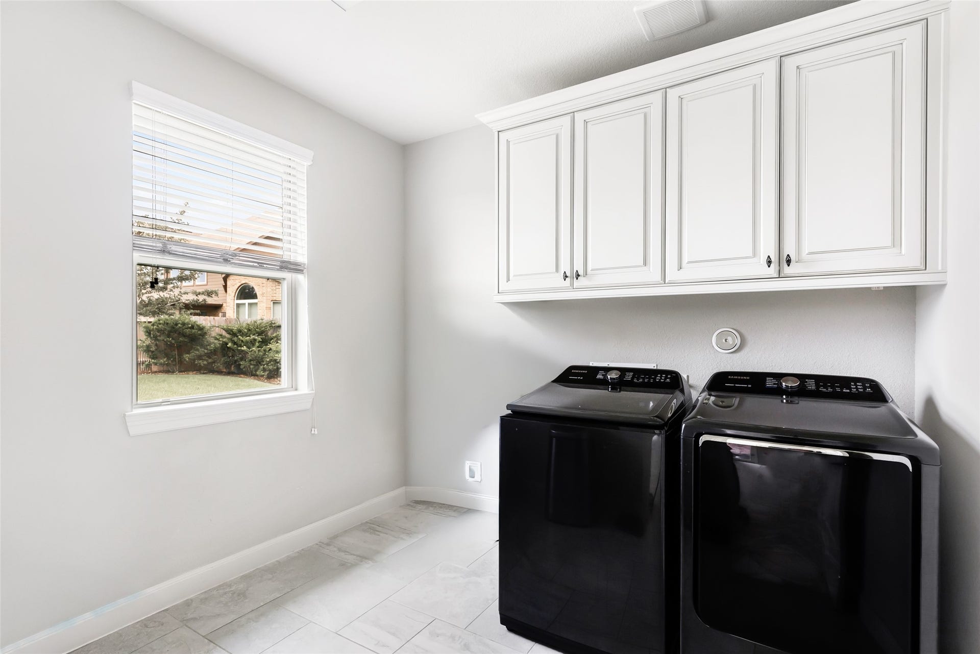 18931 Wild Thornberry Drive, Tomball, TX 77377 Large utility room with space for an extra fridge/storage and built-in cabinetry