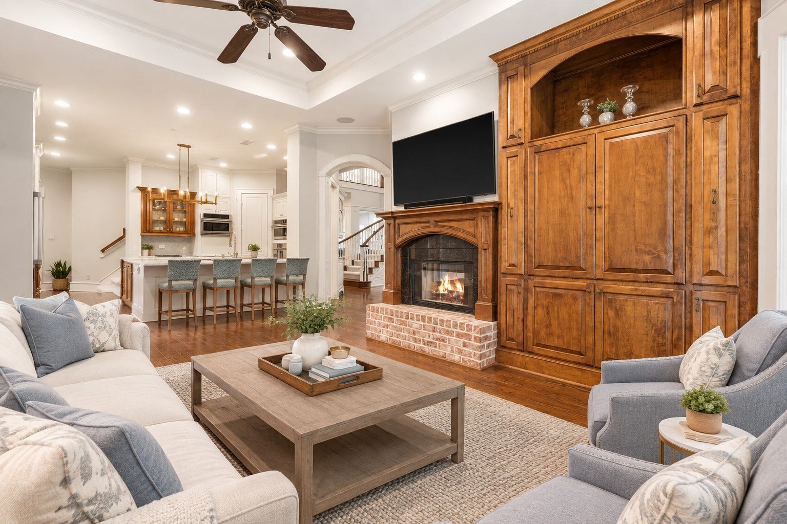 186 Sentinel Point Court, The Woodlands, TX 77382 Virtually Staged - Another view from the family open to the kitchen and adjoining breakfast.