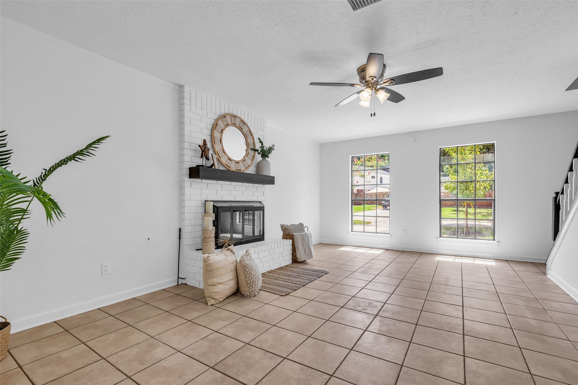 Comfortable family room featuring a cozy gas fireplace.