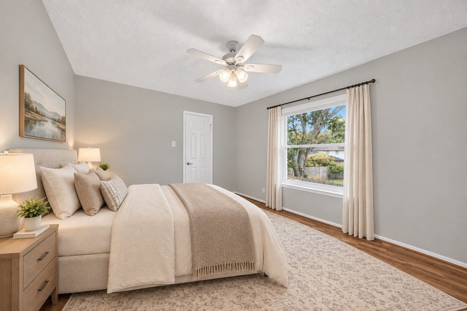 3507 Santa Rosa Lane, Sugar Land, TX 77478 A spacious and bright second bedroom featuring warm wood-look flooring and a crisp, neutral paletteoffering a cozy, restful haven for family members or guests. (virtual staged)