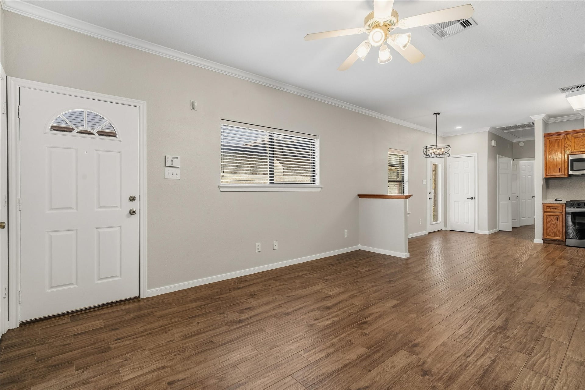304 Reppert Street, Bacliff, TX 77518 Living room at the entryway, fresh paint, updated flooring throughout