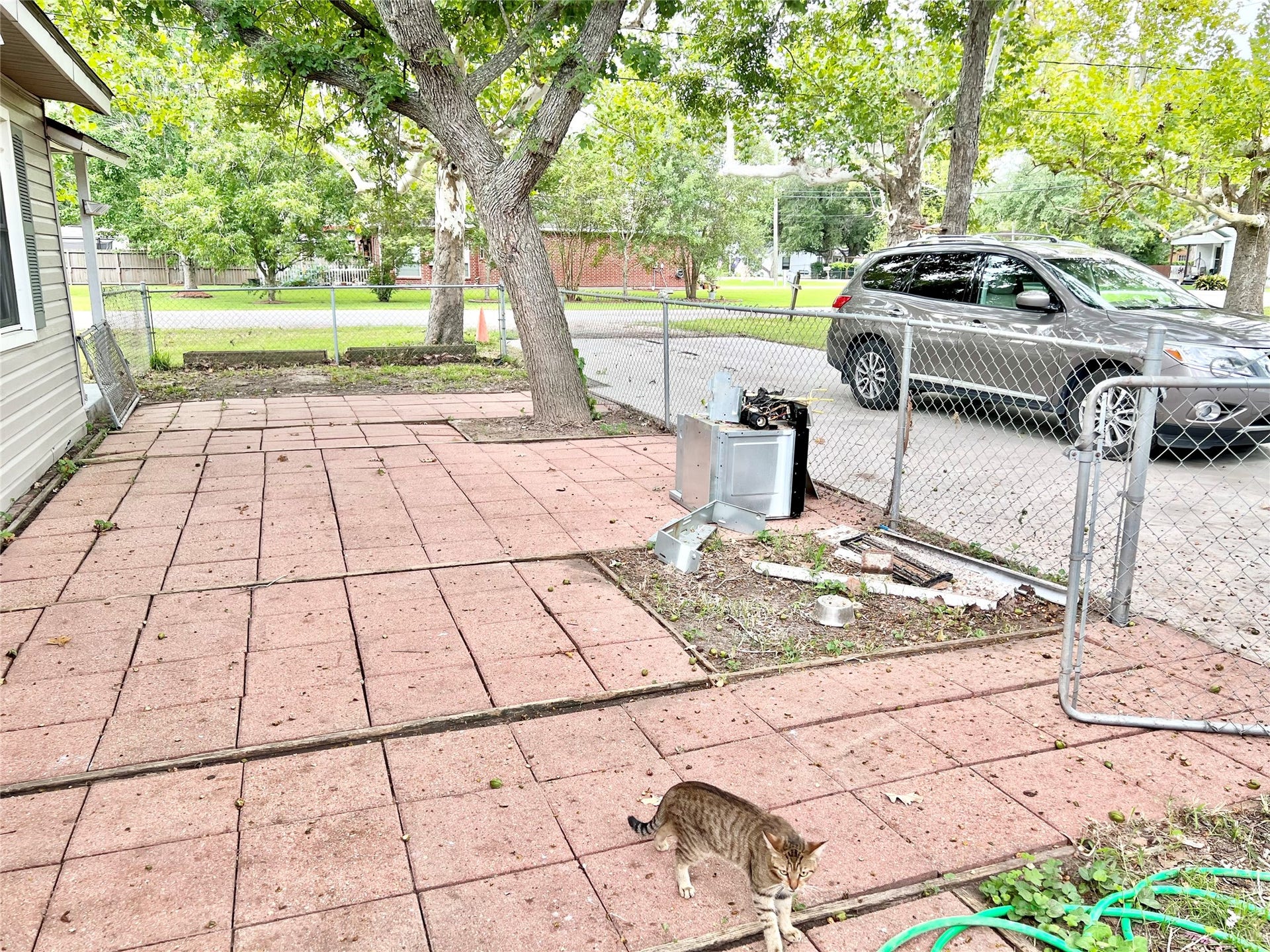14414 2nd Street Street, Santa Fe, TX 77517 Paved courtyard (which has since been cleaned up is separately fenced form the back yard which is also fenced.