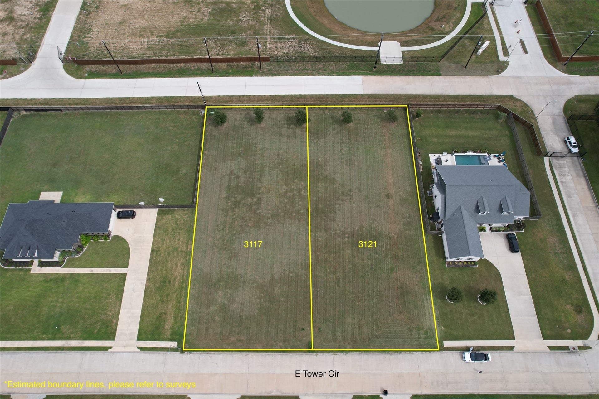3121 E TOWER Circle, Santa Fe, TX 77517 From E Tower Cir perspective. Gate and mailboxes are on the right.