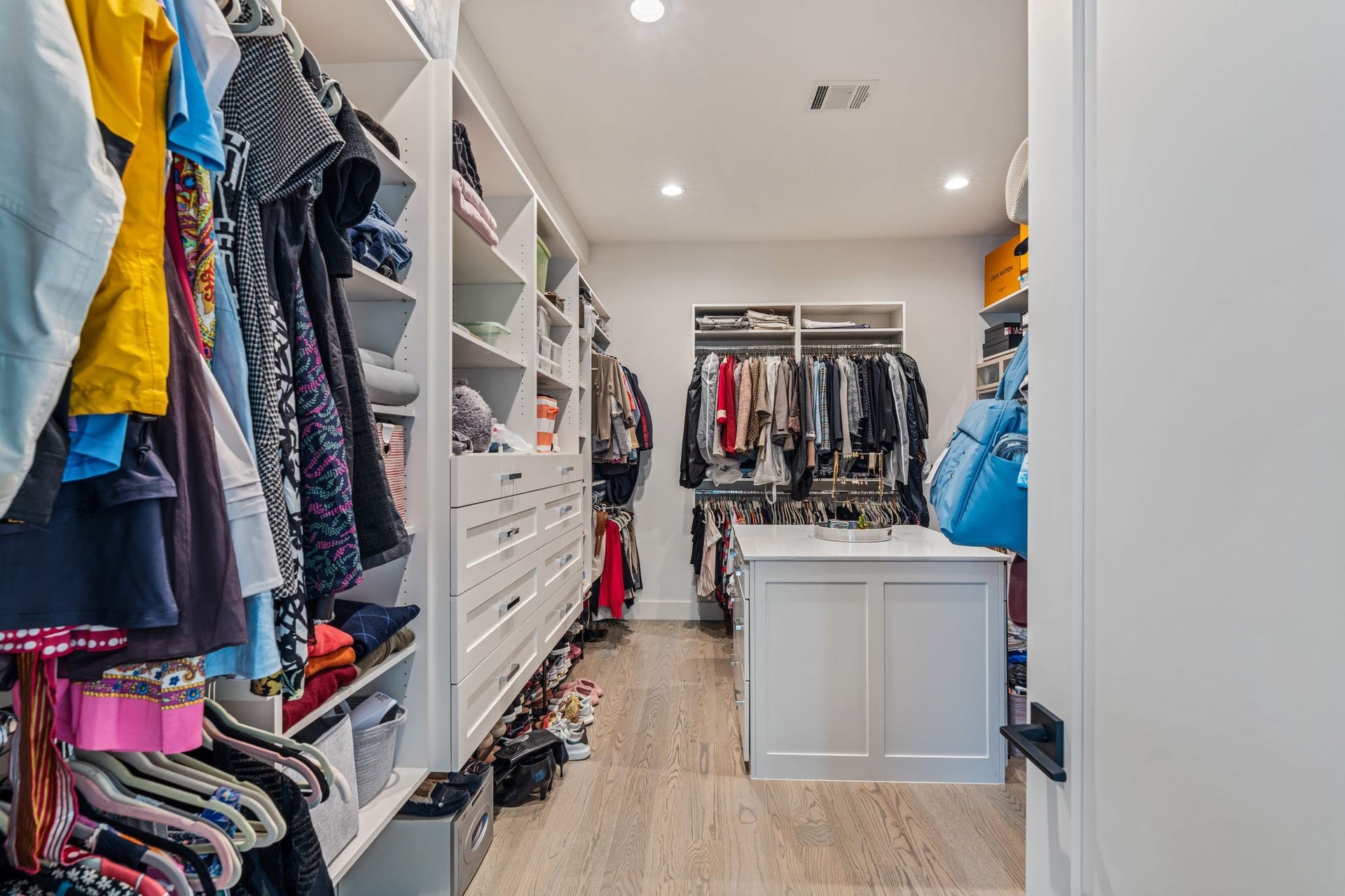4638 Merwin Street, Houston, TX 77027 The custom designed walk-in closet features built in custom cabinetry offering extensive storage and organization.