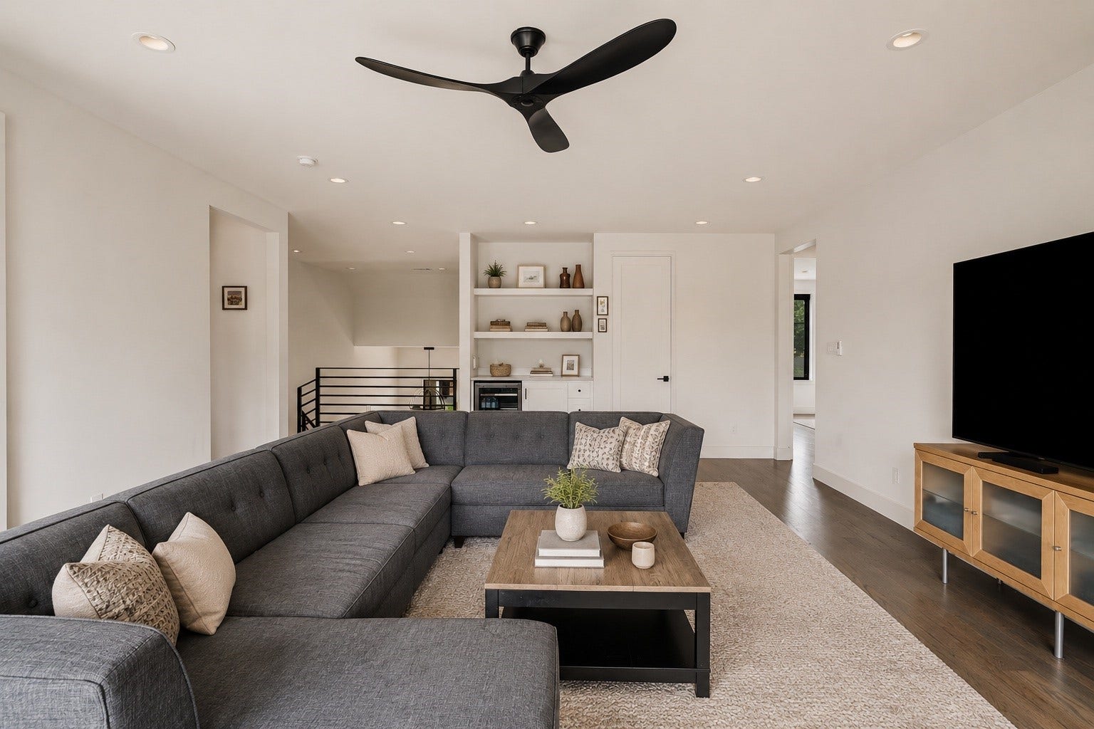 4638 Merwin Street, Houston, TX 77027 The second level opens to a spacious game room with a built in beverage refrigerator, offering a versatile additional living area.