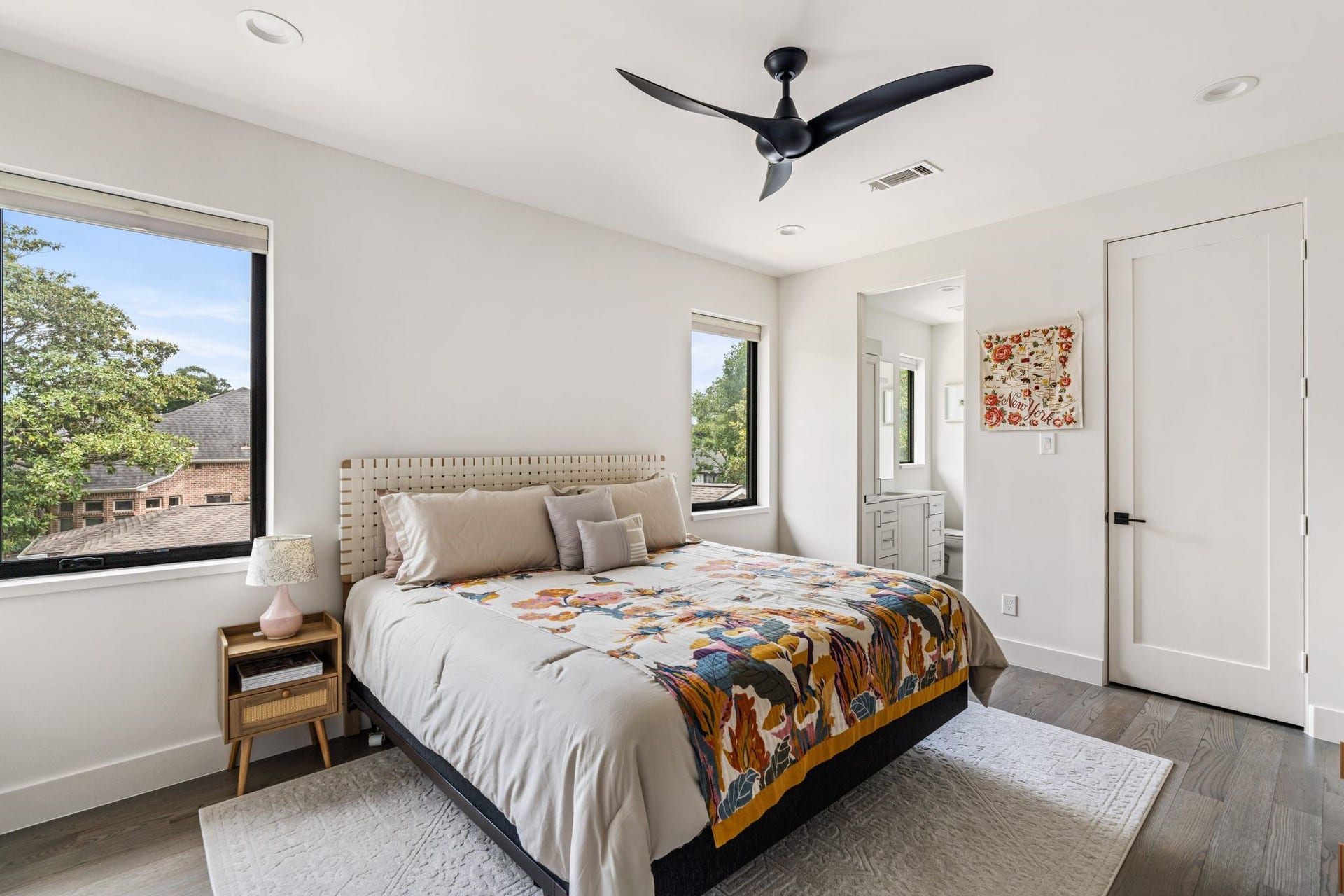 4638 Merwin Street, Houston, TX 77027 Natural light fills this generously sized secondary bedroom, complete with a private ensuite bath.