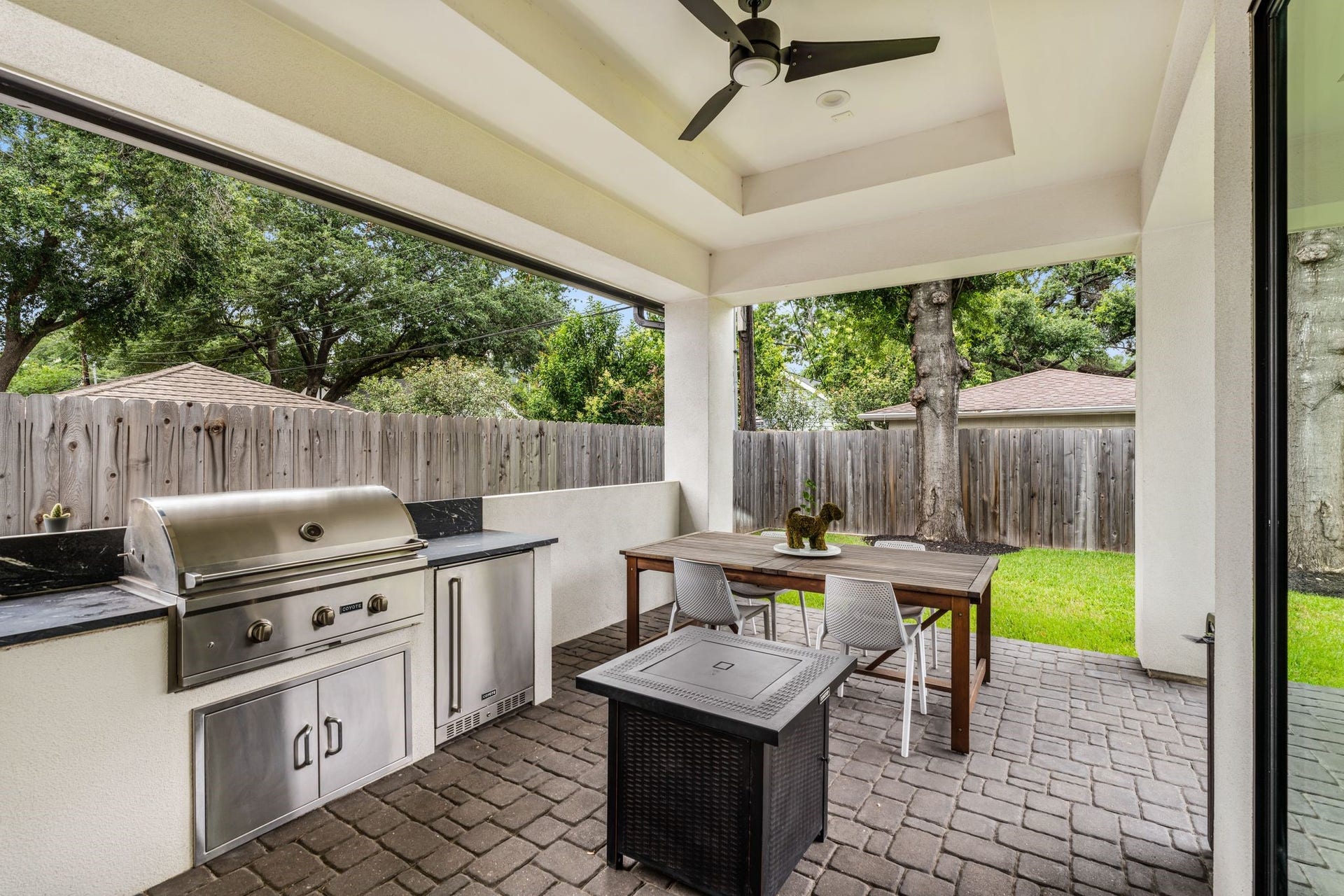 4638 Merwin Street, Houston, TX 77027 Step outside to a covered patio designed for year-round outdoor living and entertaining, complete with a fully equipped summer kitchen.