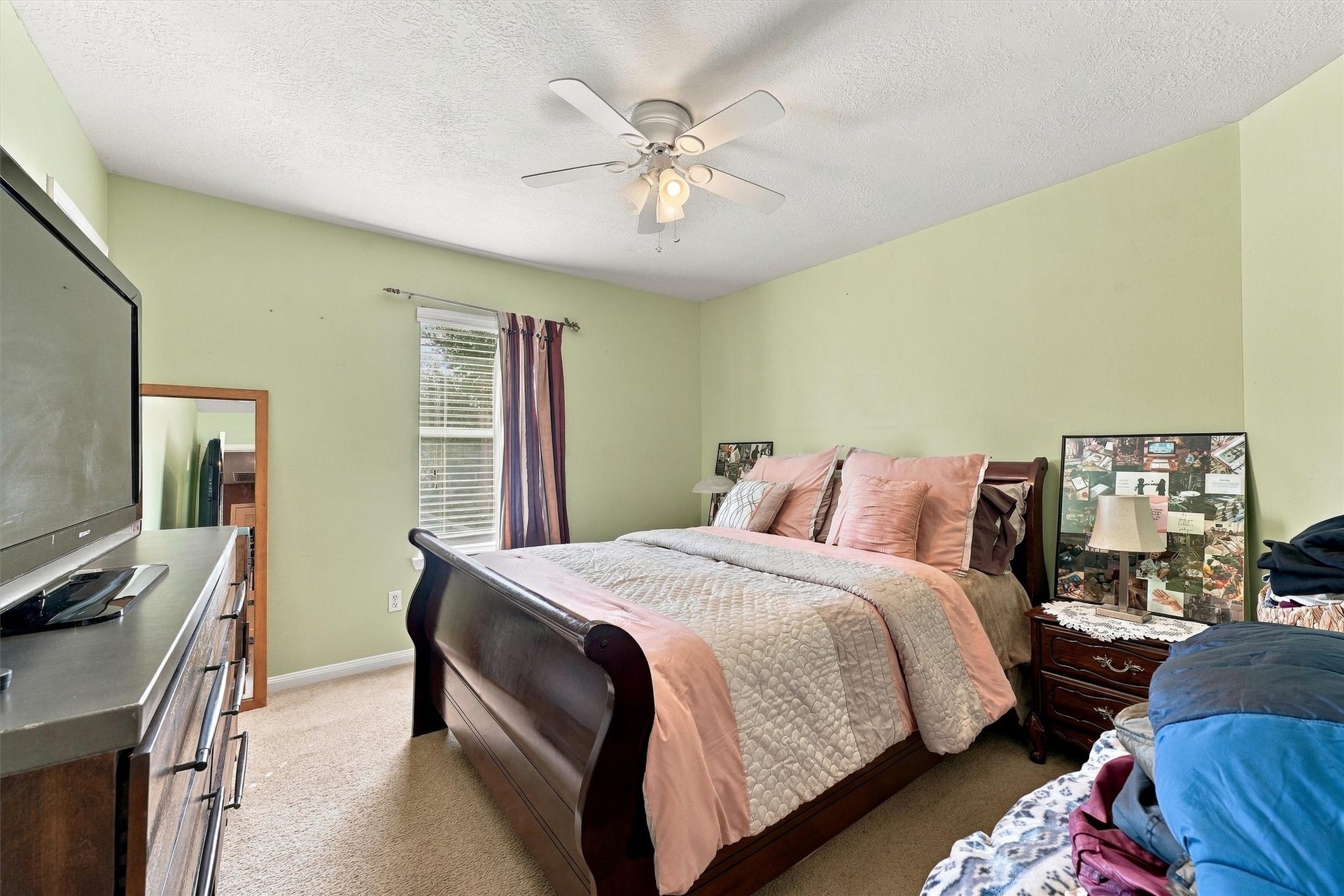 18931 Bonners Park Circle, Katy, TX 77449 Cozy bedroom with ample natural light through a large window.