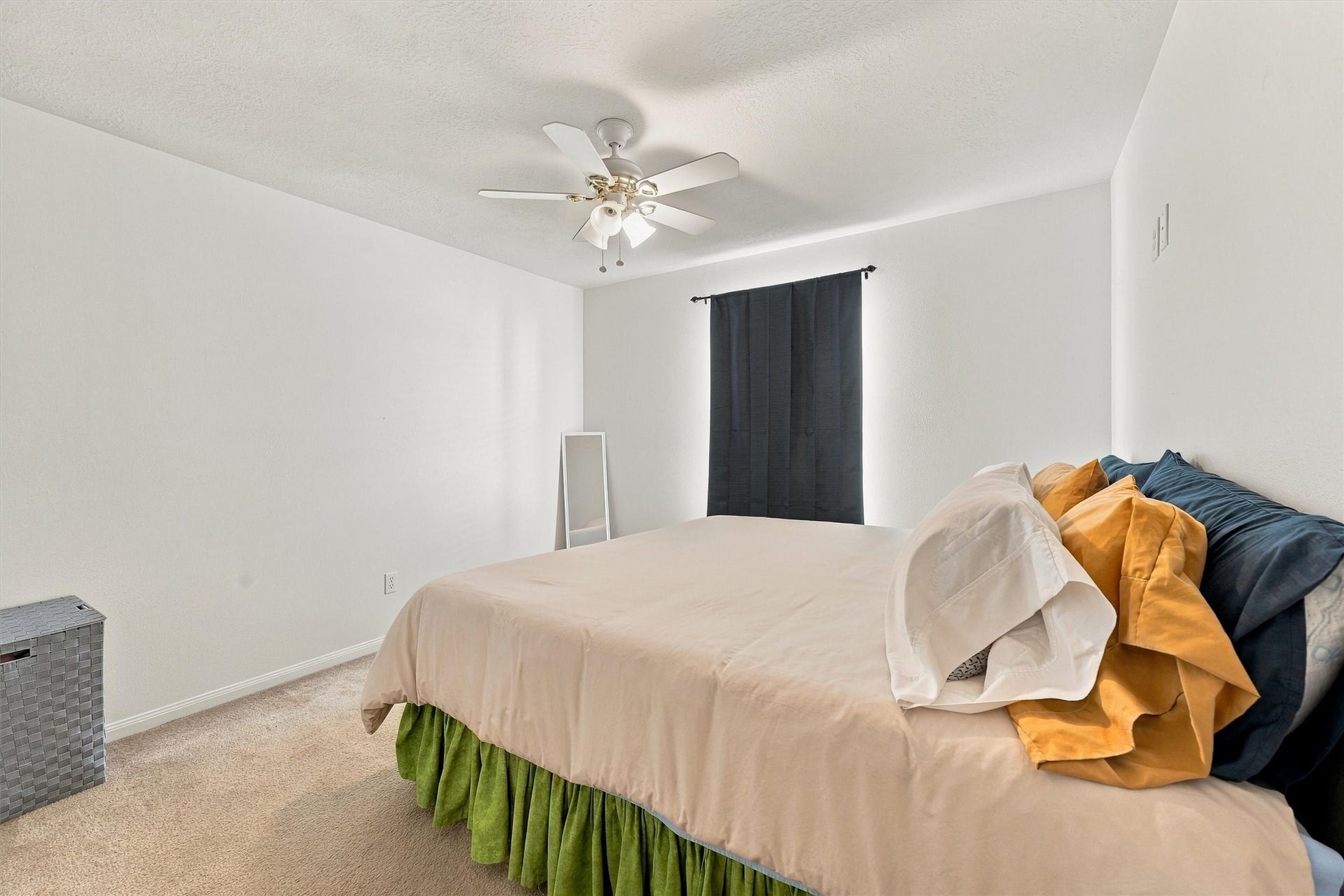 18931 Bonners Park Circle, Katy, TX 77449 Bright and cozy bedroom featuring a ceiling fan, neutral tones, and a large window for natural light.