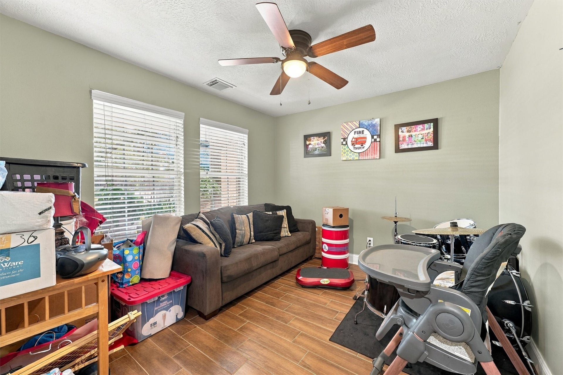 18931 Bonners Park Circle, Katy, TX 77449 Cozy and versatile living space featuring large windows for natural light, a ceiling fan