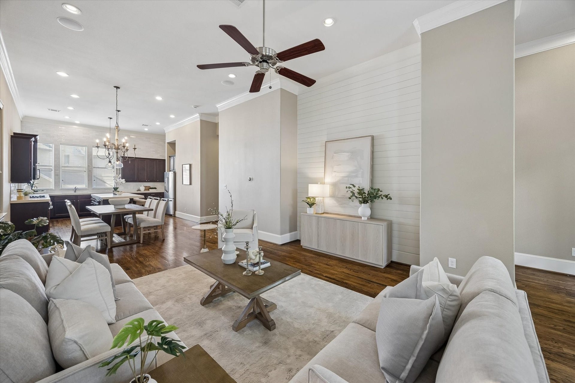 8805 Kolbe Bend Lane, Houston, TX 77080 Bright living room with hardwood floors, architectural detailing and a stylish shiplap accent wall.