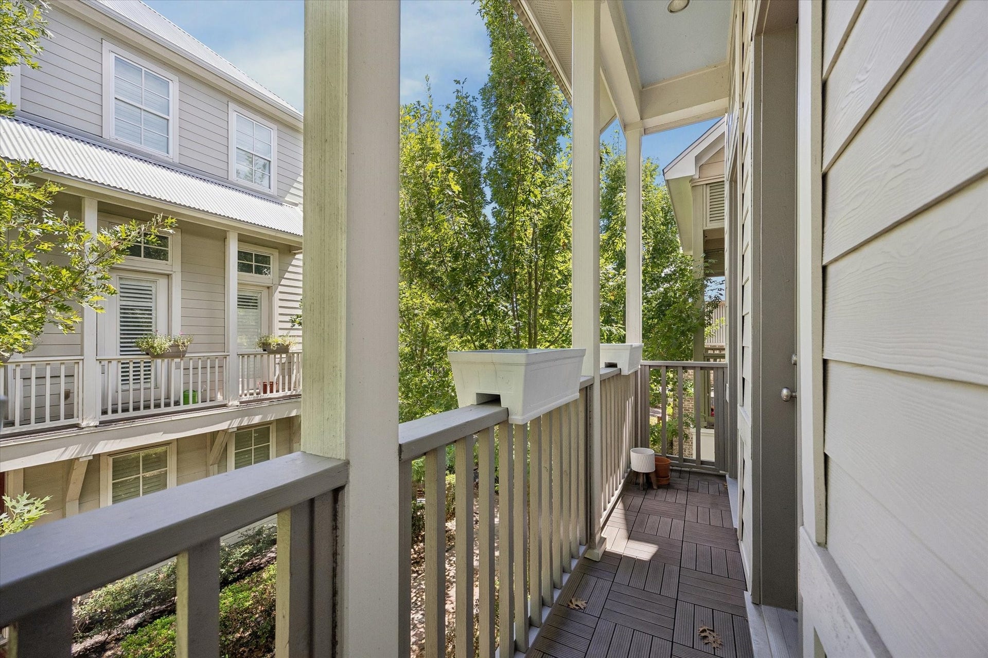 8805 Kolbe Bend Lane, Houston, TX 77080 Private covered balcony right off the living room overlooking the landscaped surroundings, offering a quiet outdoor space to relax.
