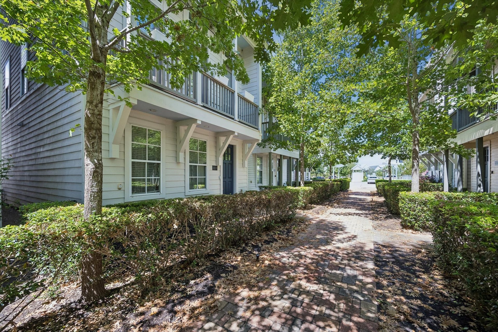 8805 Kolbe Bend Lane, Houston, TX 77080 Shaded brick walkway creates an inviting approach to the home through the landscaped community.