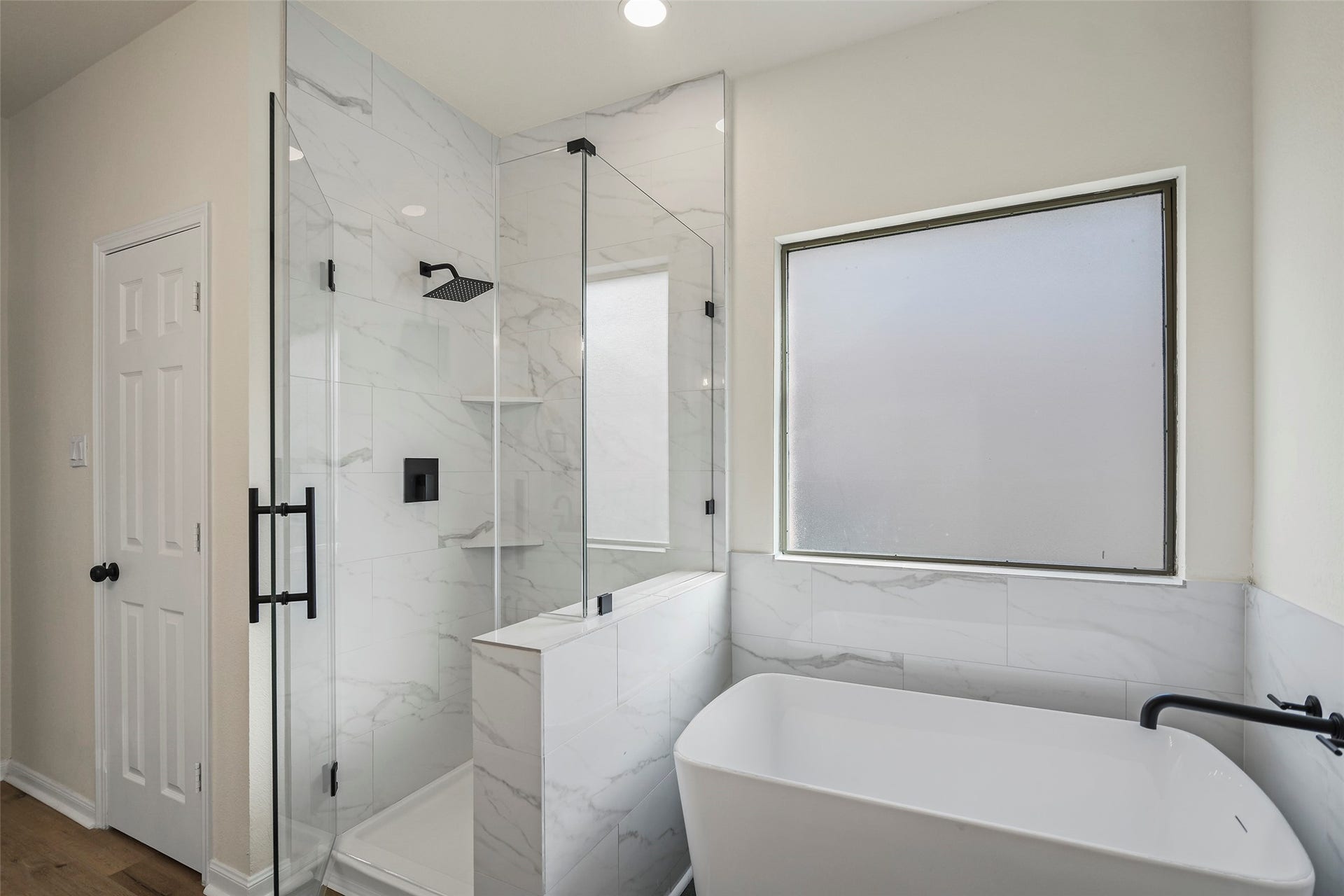 Primary Bathroom. New cabinets, countertops, shower, tub, and fixtures.