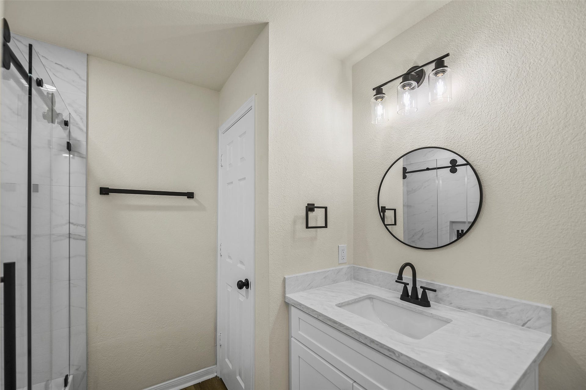 Secondary Bathroom. New cabinets, countertops, shower, tub, and fixtures.