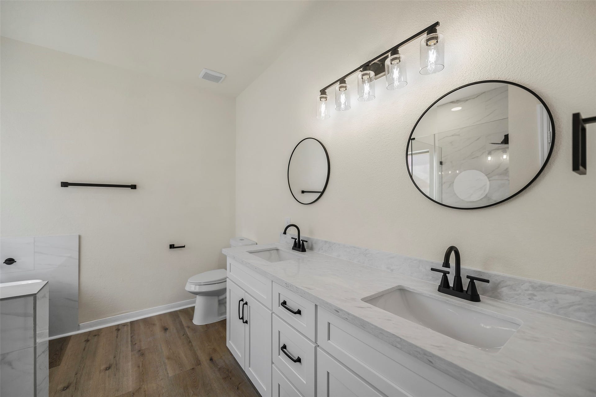 Primary Bathroom. New cabinets, countertops, shower, tub, and fixtures.