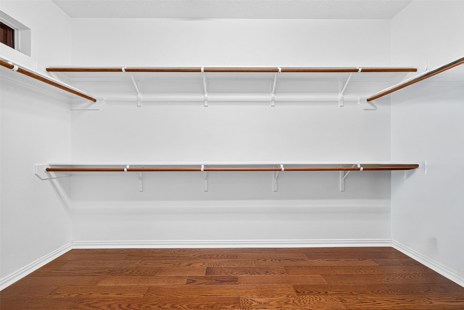 14242 Ashmore Reef Court, Sugar Land, TX 77498 Expansive walk-in closet featuring built-in shelving, thoughtfully designed to keep your wardrobe organized while providing plenty of space to get ready