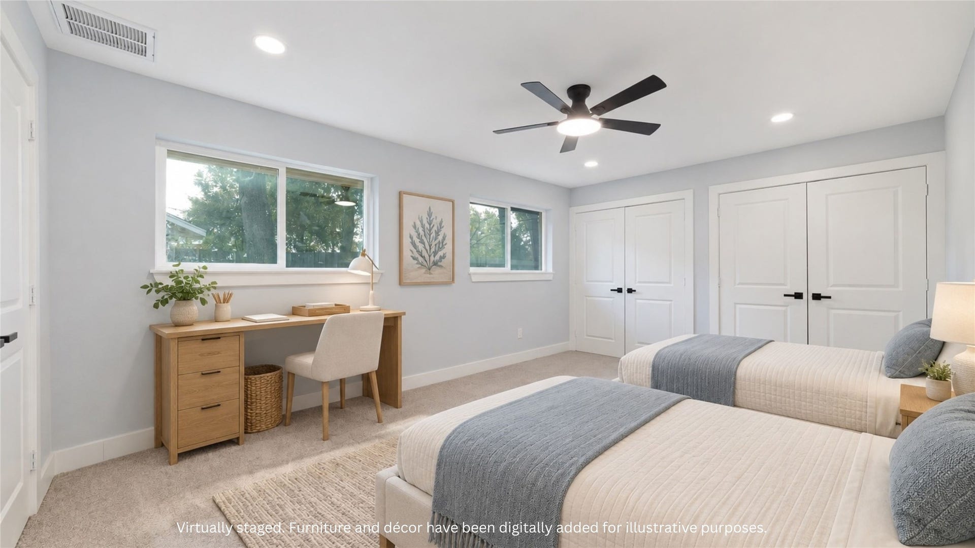Virtually staged bedroom illustrating a two-bed arrangement with a desk beneath the windows. Furnishings and dcor digitally added; layout shown for illustration.
