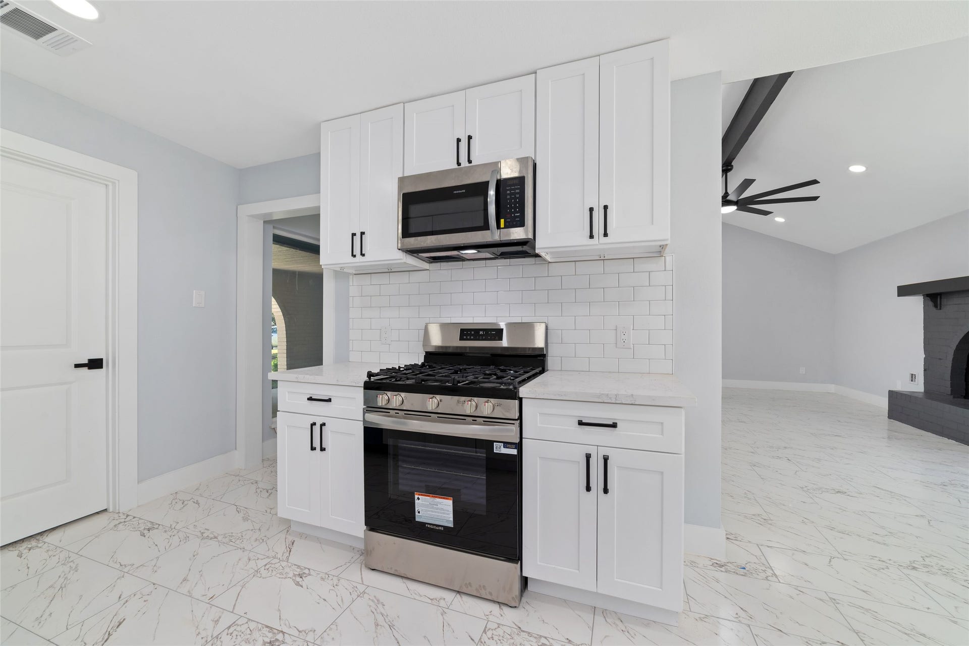 The kitchen provides a welcoming setting for meal preparation, morning routines, and everyday cooking.