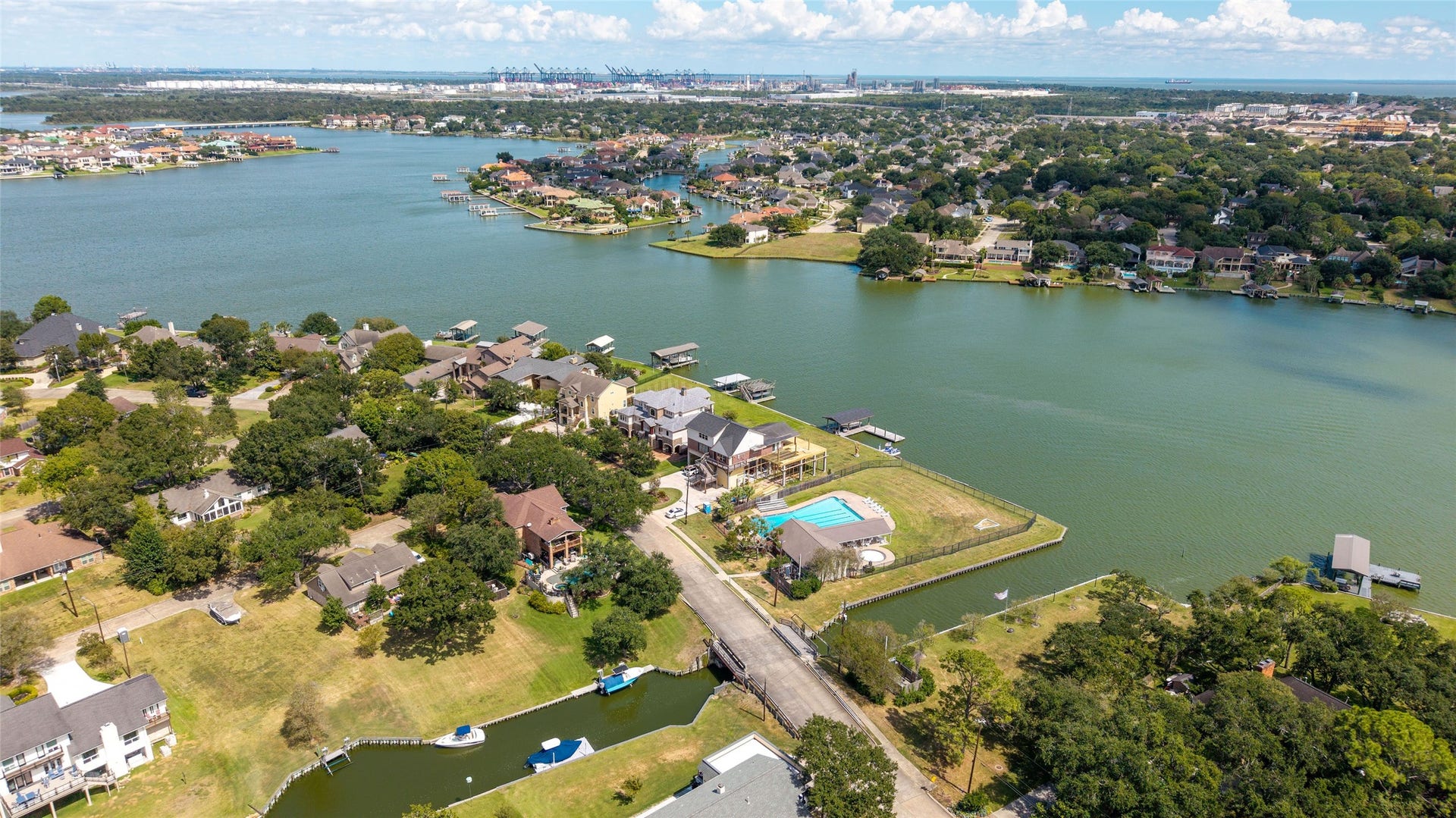 Scenic aerial view of Taylor Lake, showcasing the shoreline, waterfront homes, and surrounding greenery near Timber Cove.