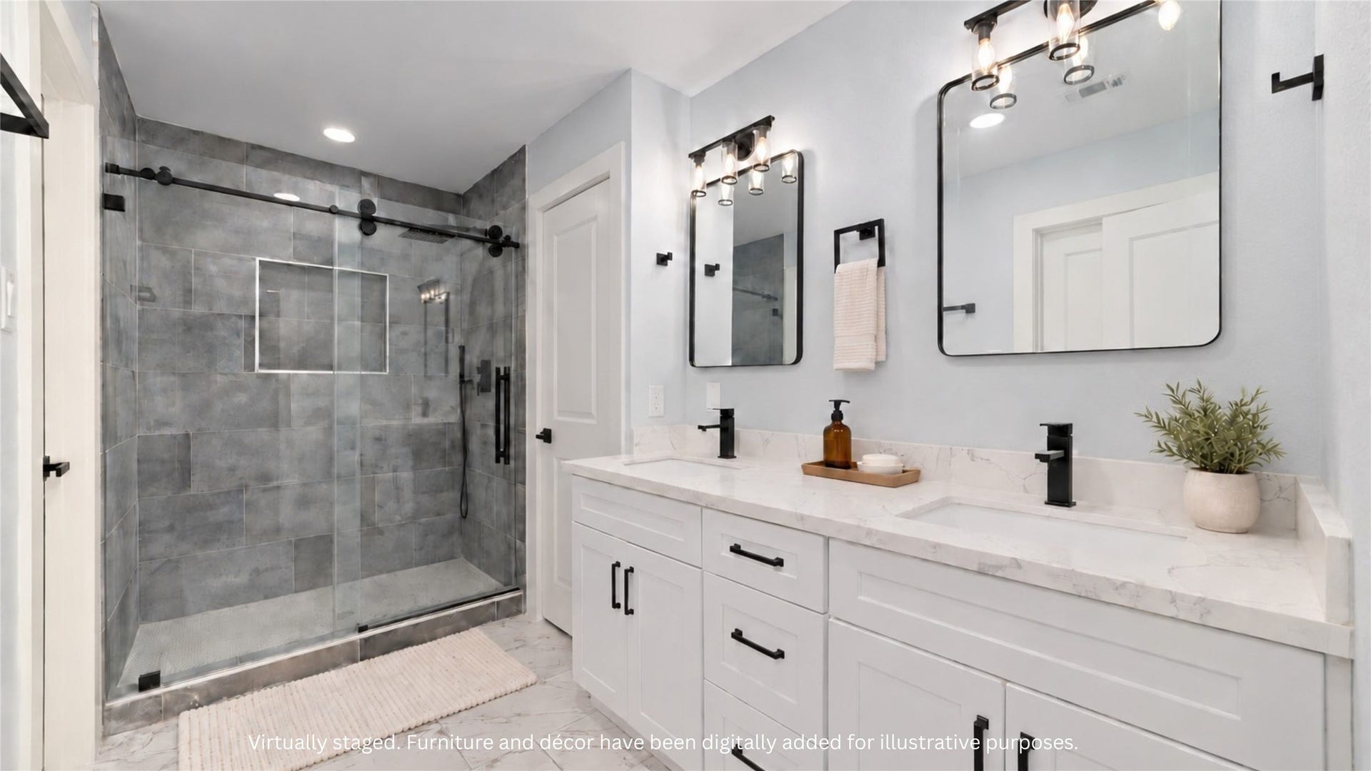 Virtually staged bathroom featuring a dual-sink vanity, individual mirrors and a glass-enclosed tiled shower. Accessories and dcor digitally added for illustration.