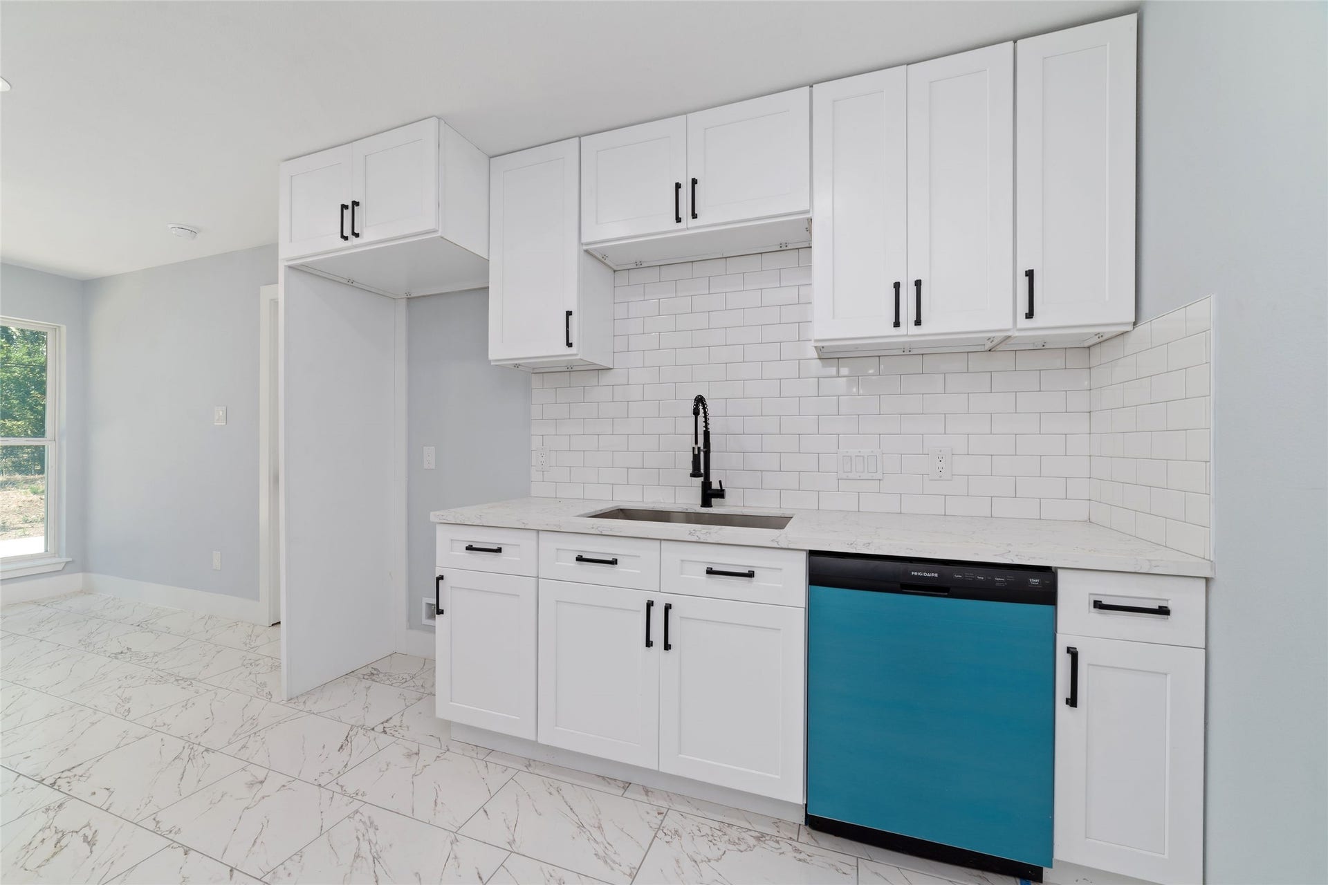 The kitchen provides a welcoming setting for meal preparation, morning routines, and everyday cooking.