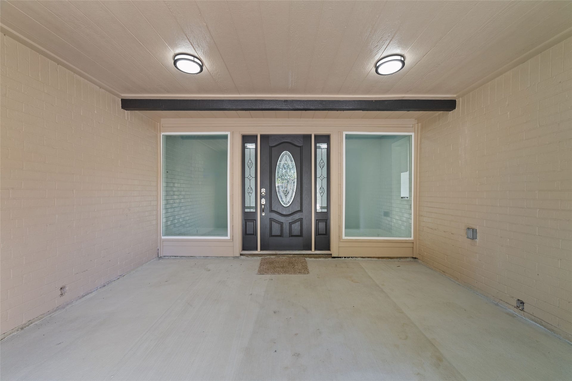 A covered front entry welcomes you inside, where the entry hallway introduces the homes interior.